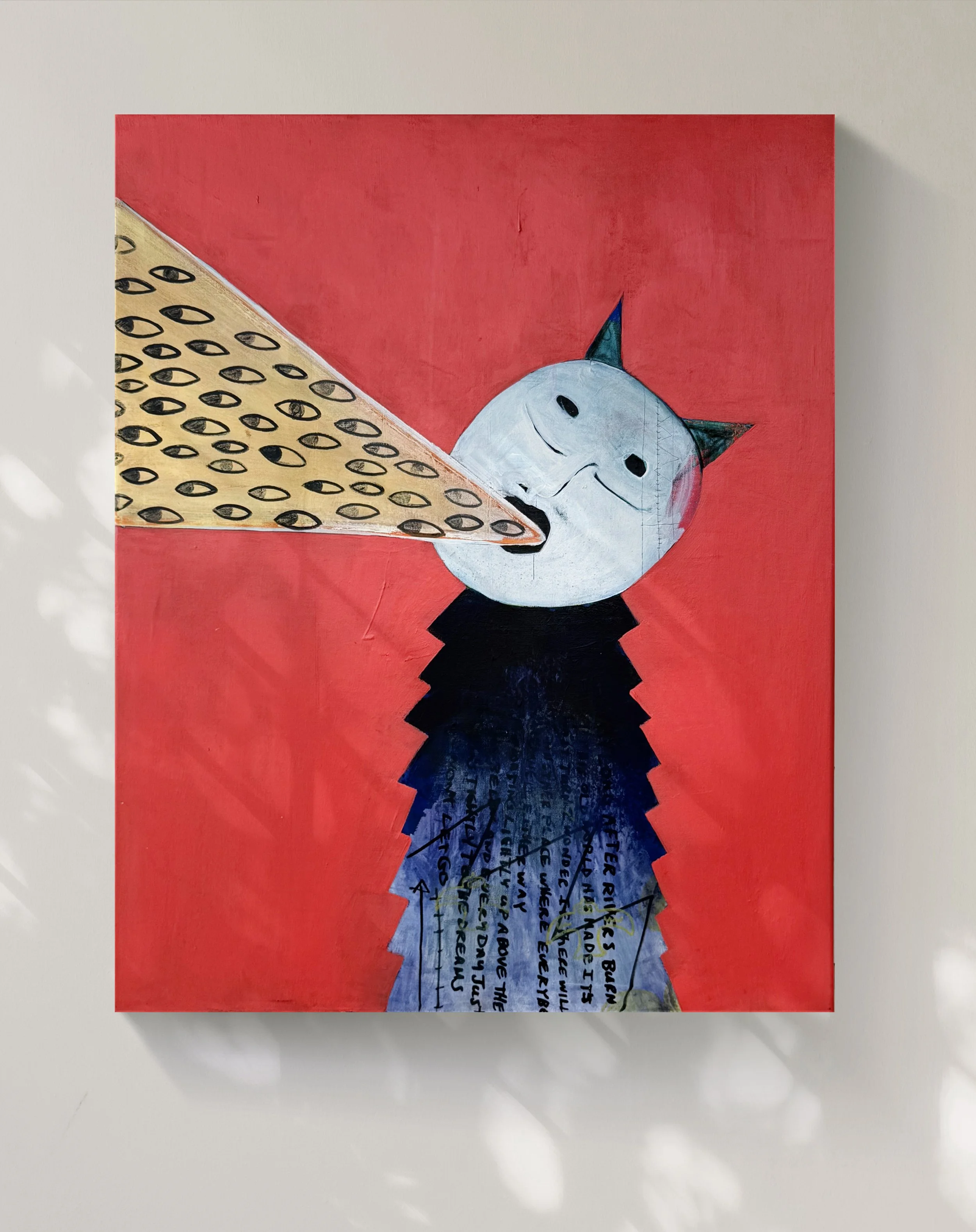 A painting of a humanoid figure with a white, rabbit-like face and black, cat-like ears, against a red background. The figure's body is covered in blue clothing with black cursive text written all over.