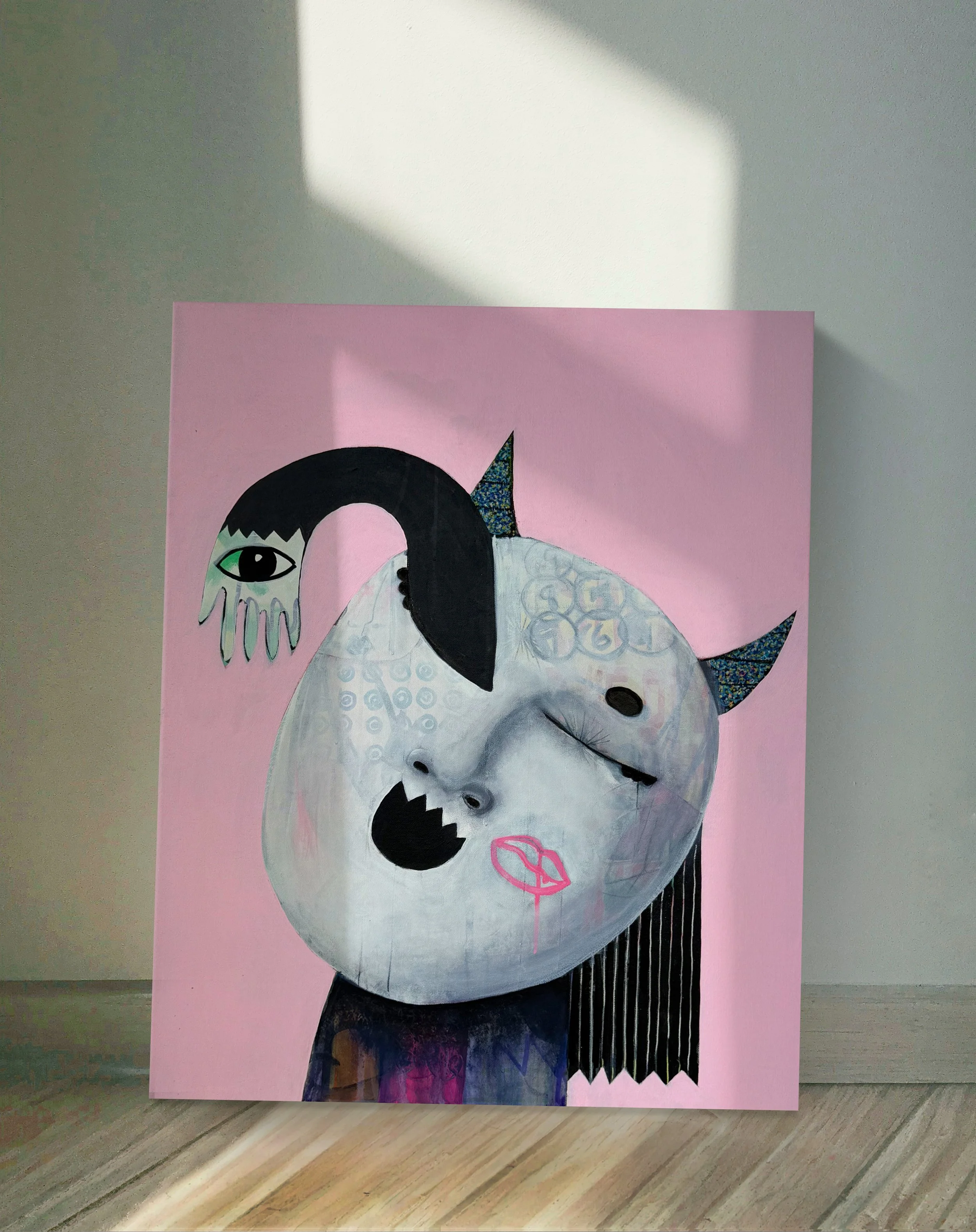 A collage of various artistic elements including a painted face mask and abstract drawings on a pink background, with some baroque style patterns and a rainbow-colored unicorn horn.
