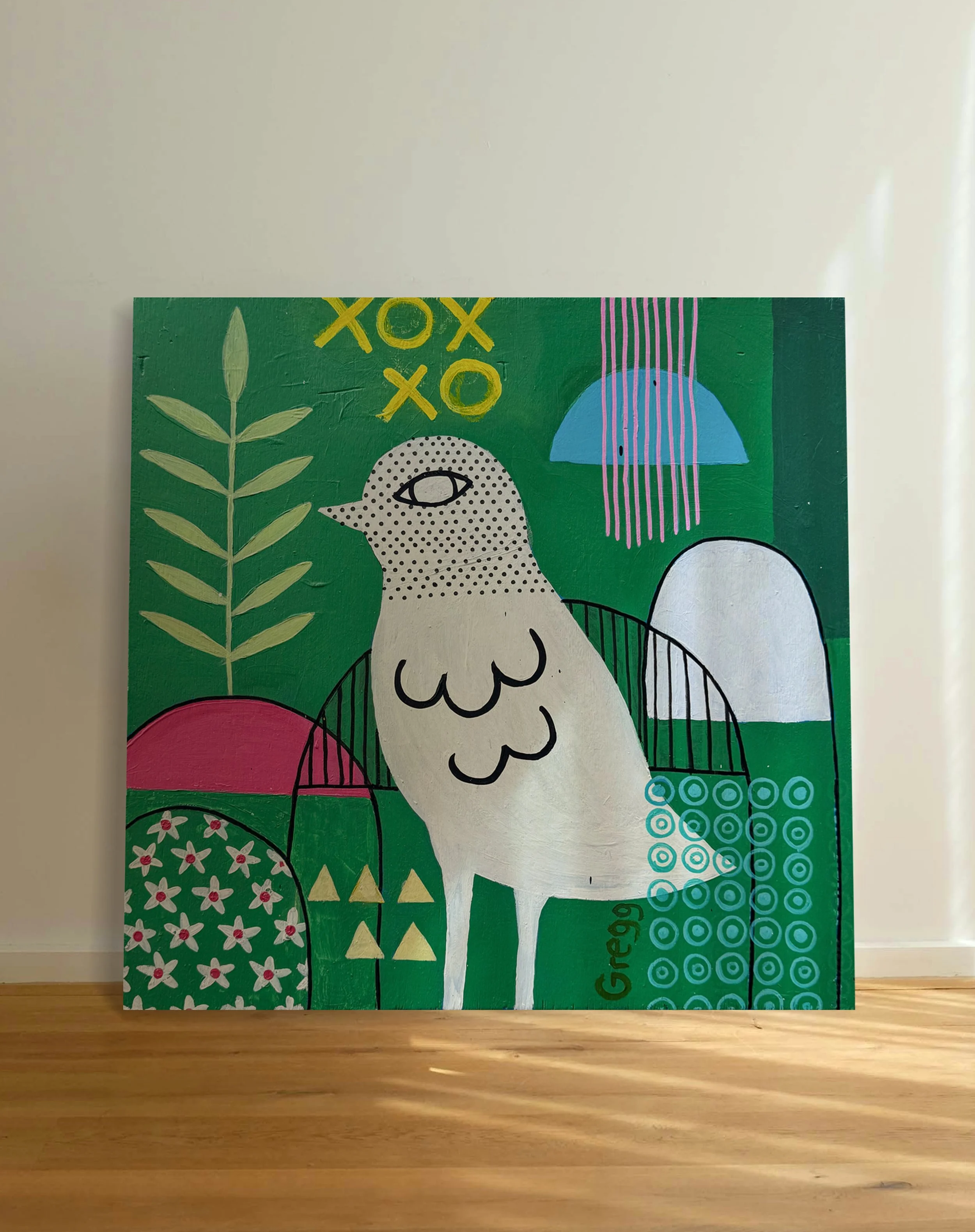 A colorful abstract painting on a green background featuring various shapes including a white bird, flowers, leaf, geometric patterns, and the word 'Congratulations' written vertically.