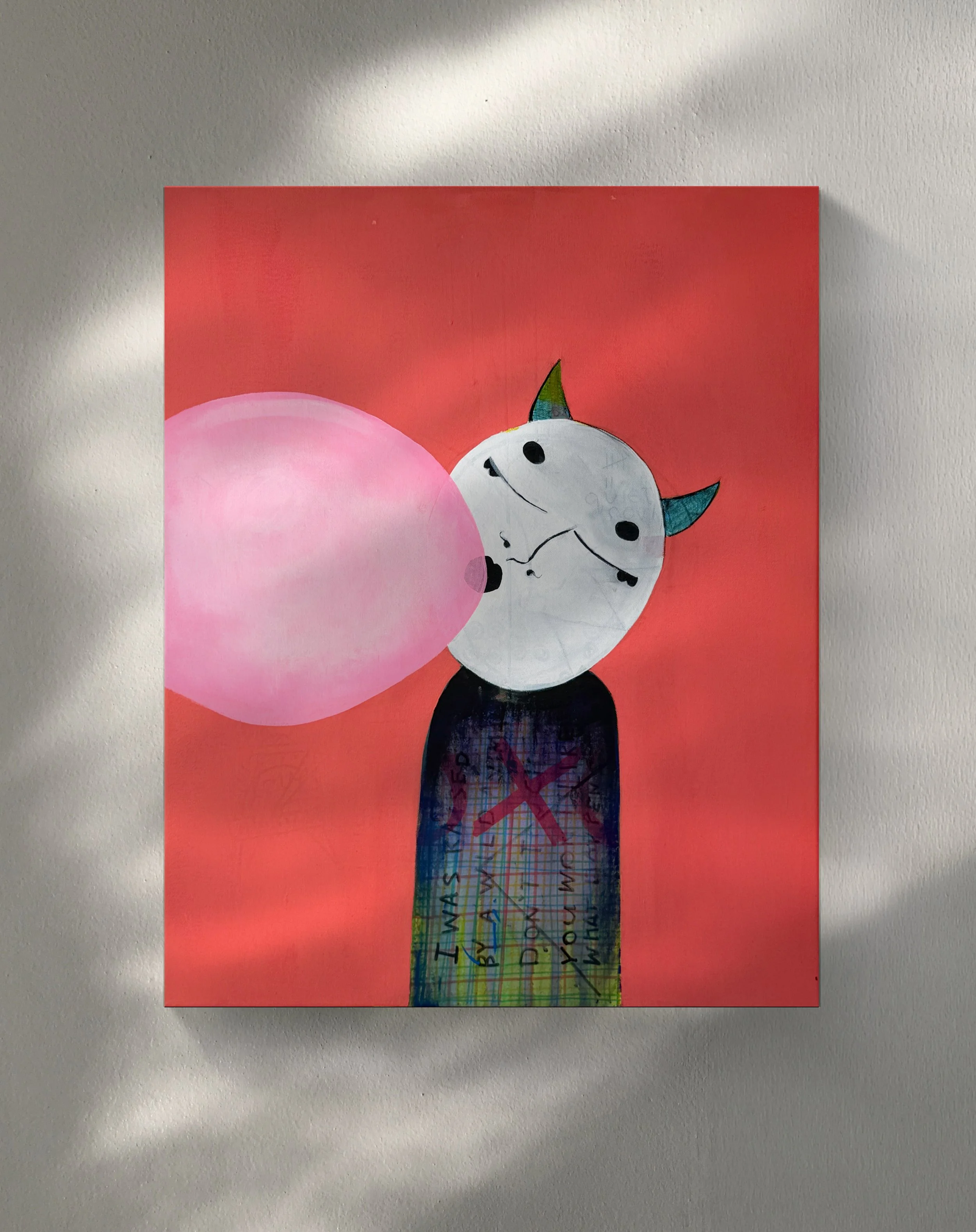 drawing of a white unicorn with a rainbow-colored horn and ears, holding a large pink balloon, set against a red background, with a long decorated paper strip with handwritten text hanging from the unicorn.