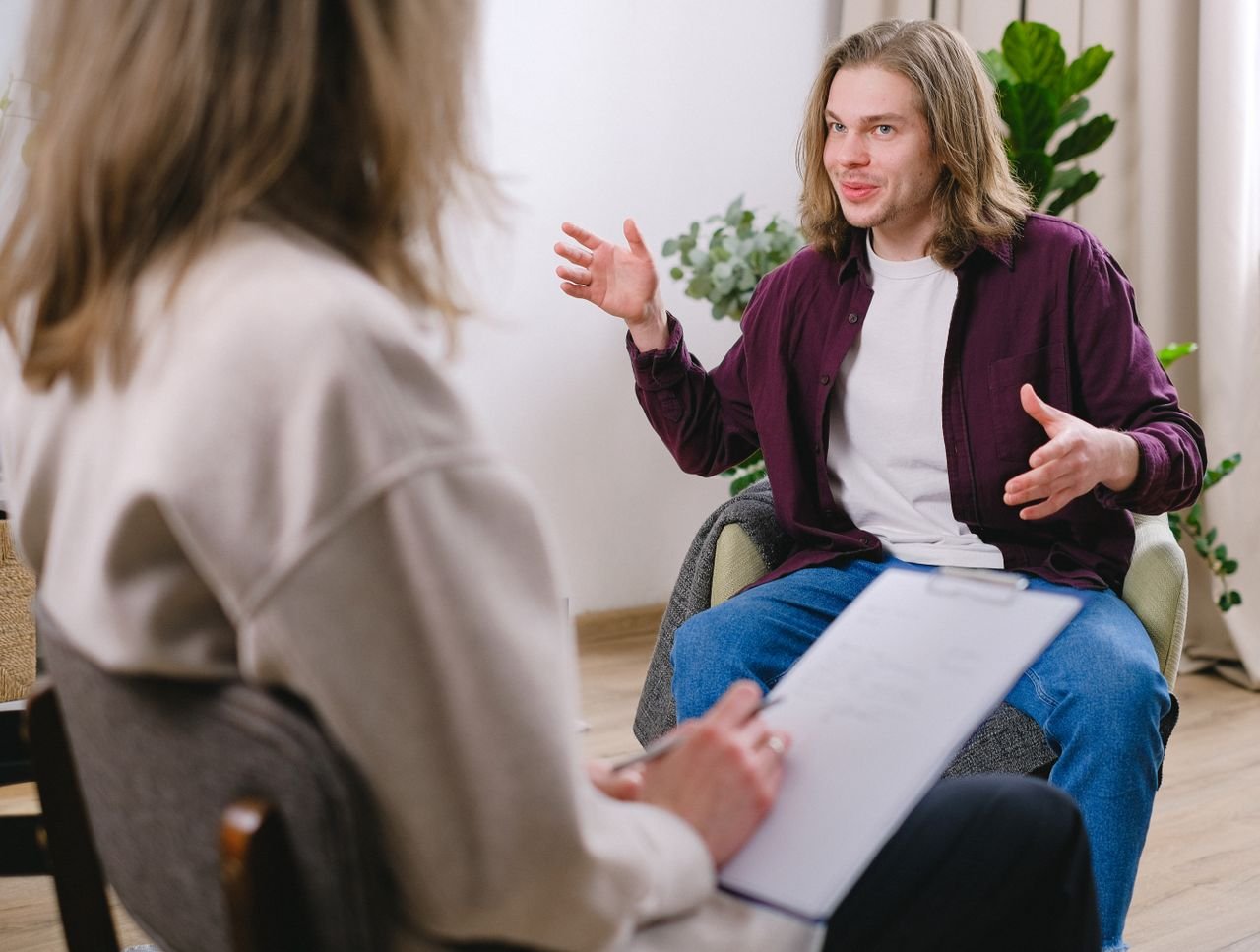 Man sitting in chair in 1:1 therapy session