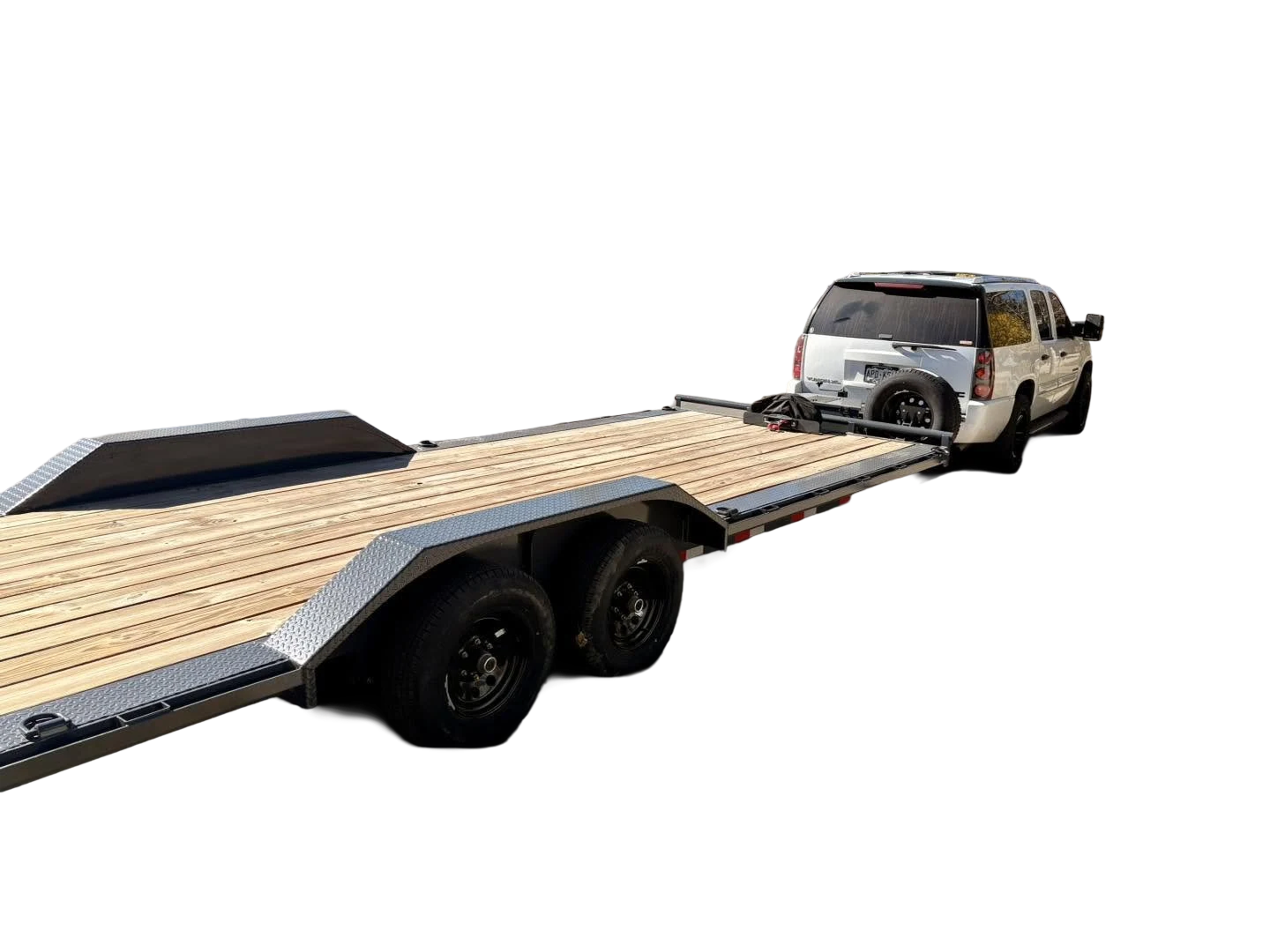 A 22' flatbed trailer with a wooden deck attached to a white SUV.