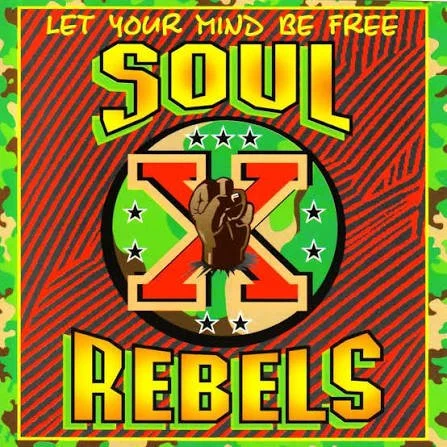 Colorful poster with the phrase 'Let Your Mind Be Free' at the top, featuring the words 'Soul Rebels' in large yellow and red letters, with a raised fist in the center surrounded by stars and an 'X' background.