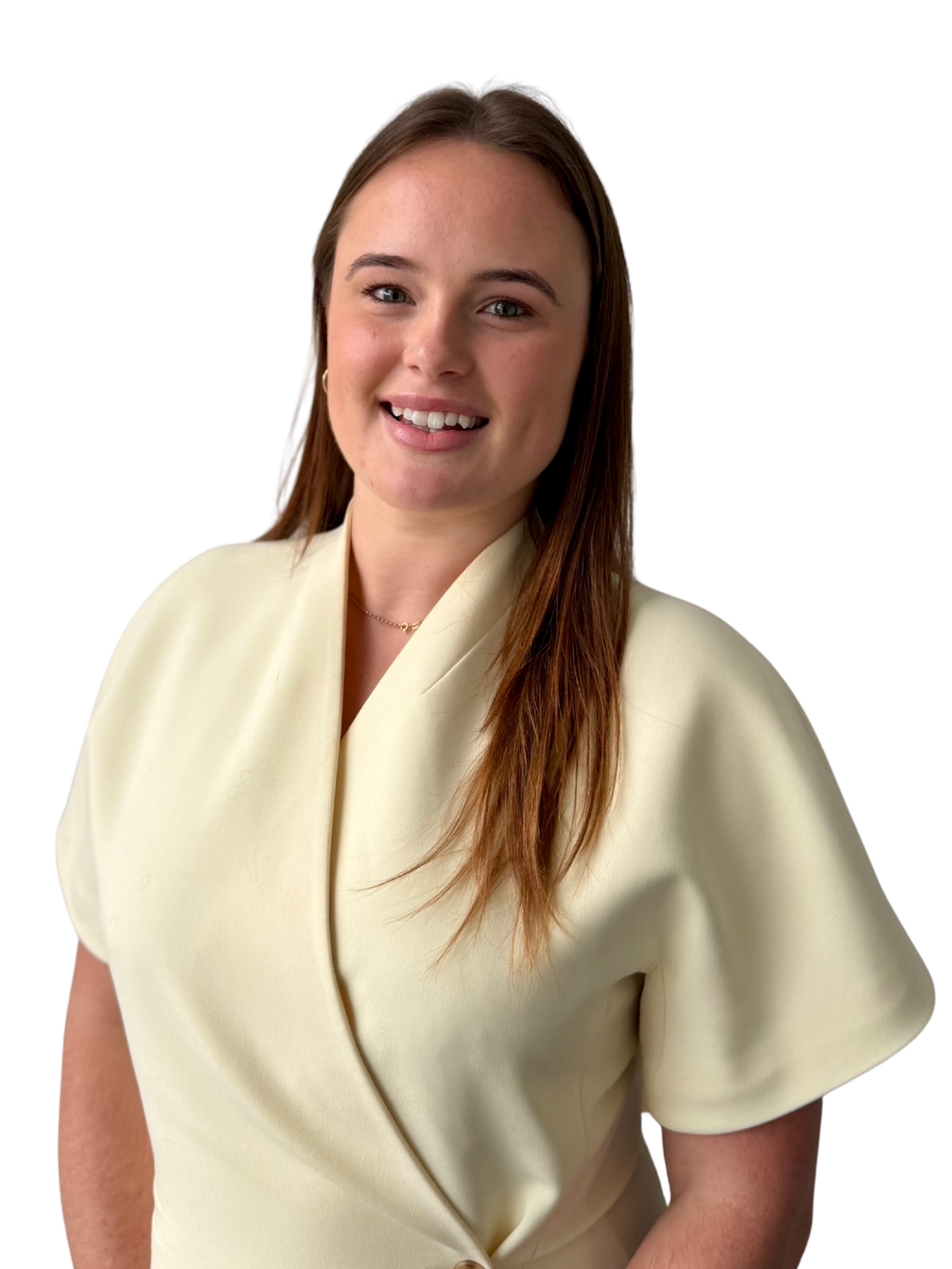 A woman with long brown hair wearing a cream-colored, short-sleeved, V-neck top, smiling against a plain white background.