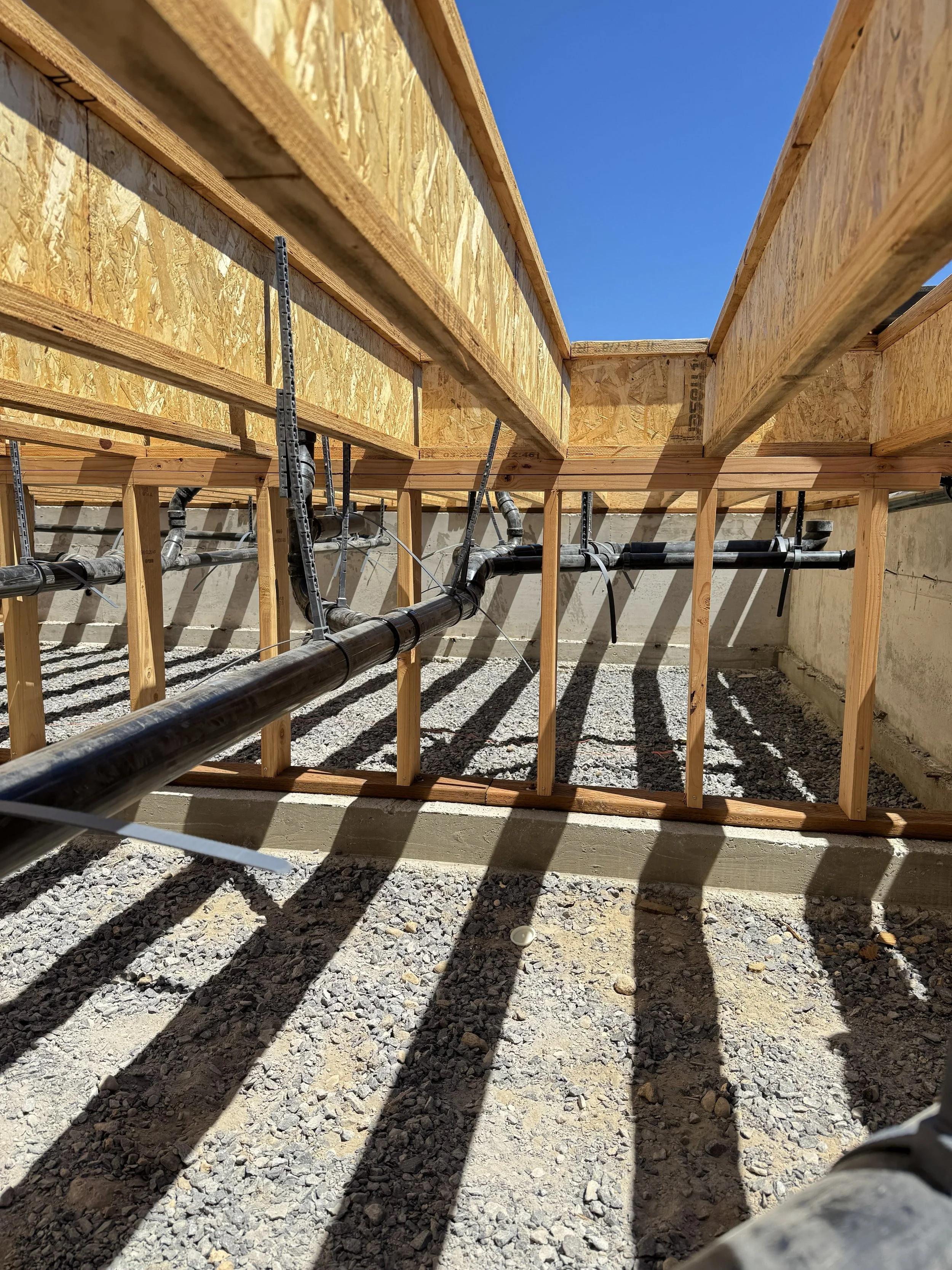 this is a side view of the plumbing system in a underfloor of a house