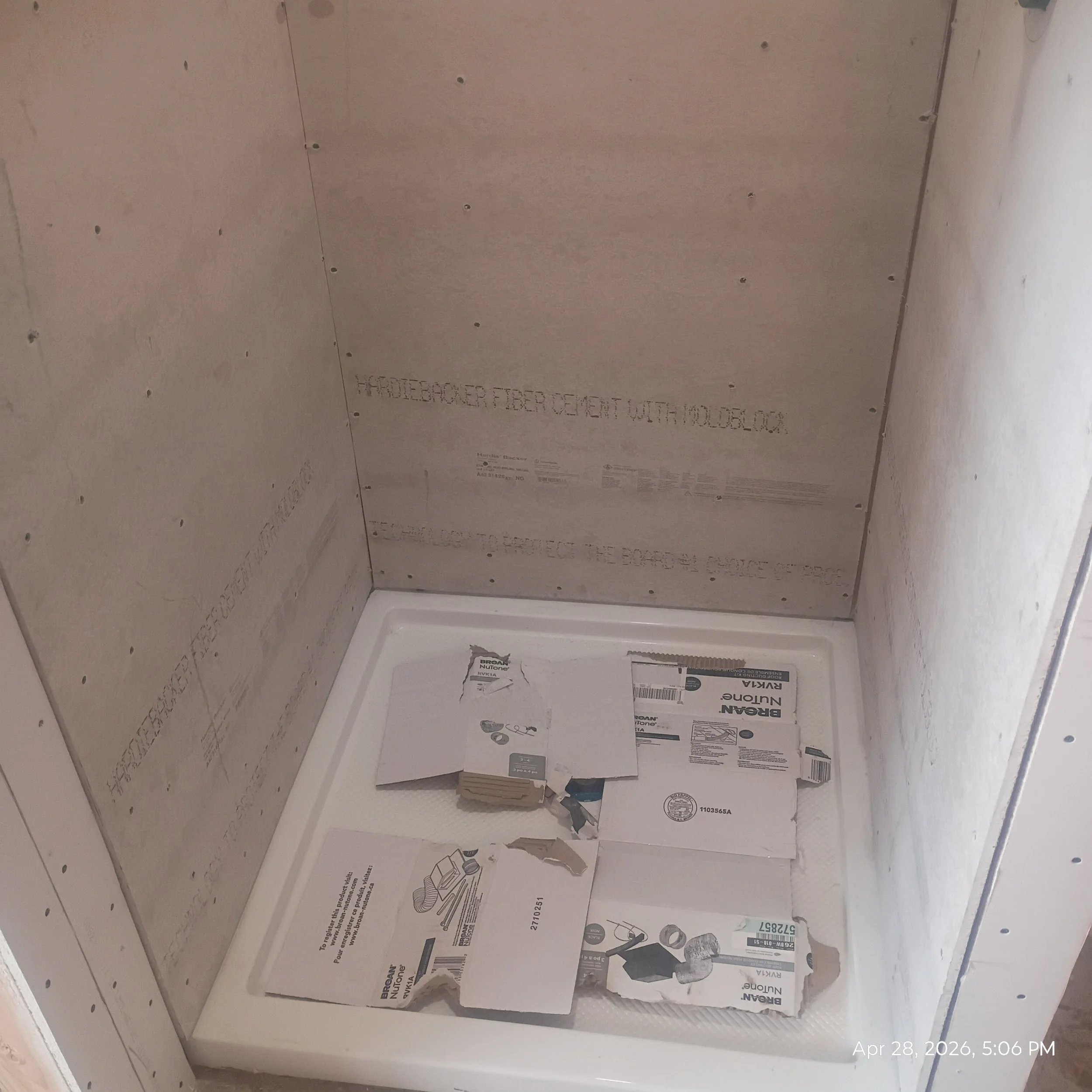 Unfinished bathroom with drywall panels and visible construction materials. The bottom right corner shows the date April 28, 2026, and the time 5:06 PM.