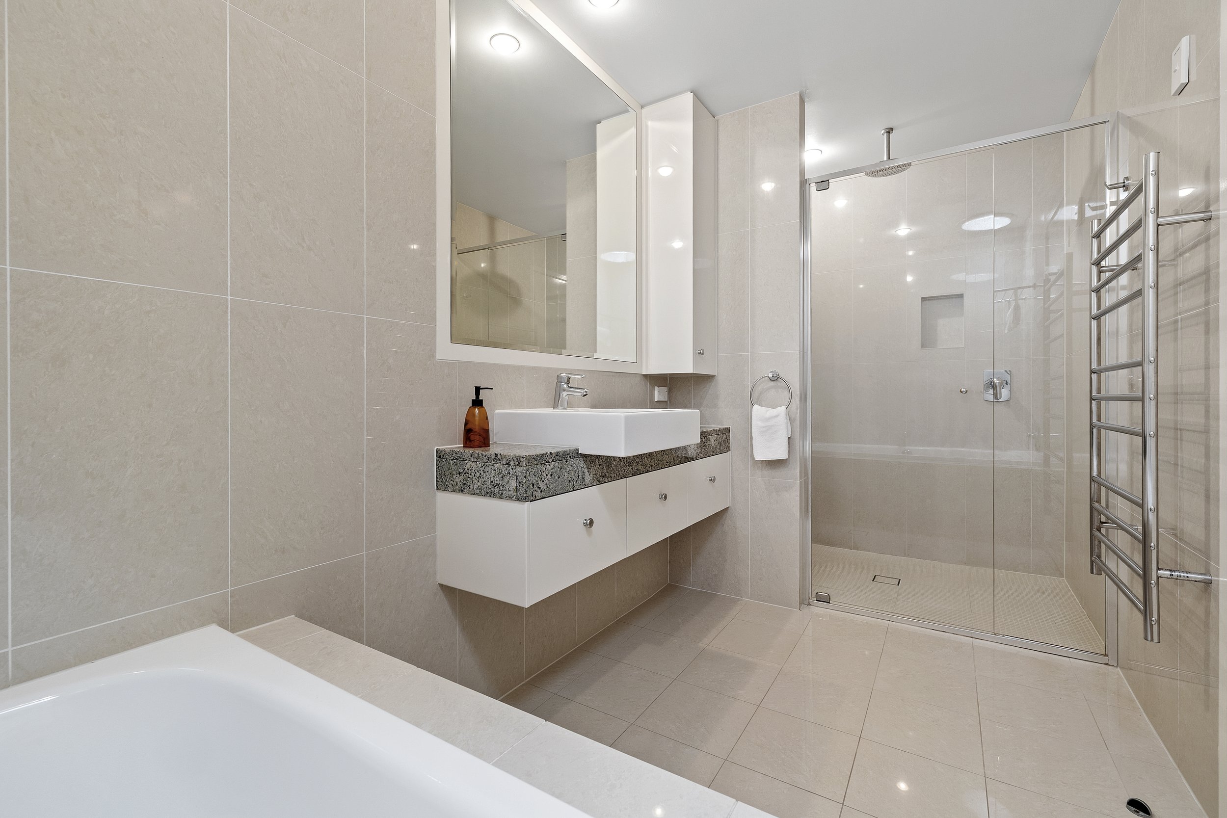 Modern large family bathroom with deep tub, large shower at Ming 3 Beachfront on Marine Pde