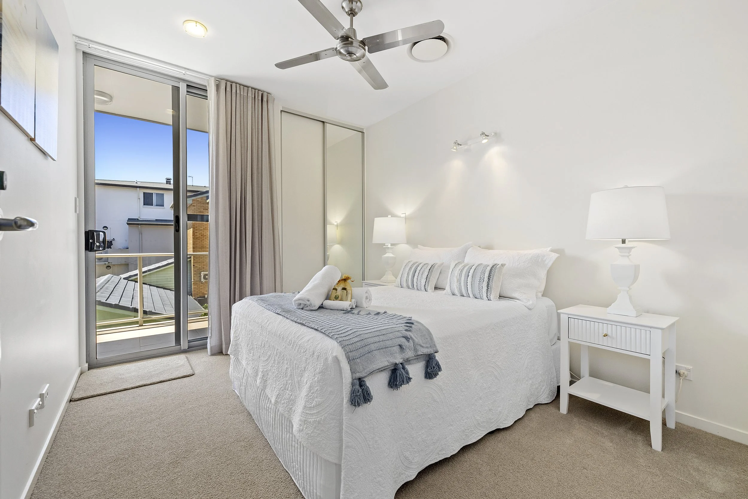 Comfortable guest bedroom with coastal artwork and natural light at MING 3 in Kingscliff.