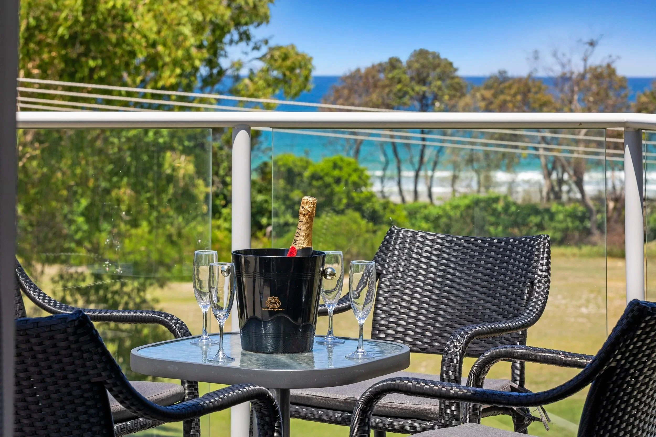 Outdoor table for sunset drinks on the private rooftop terrace at Ming 3 .