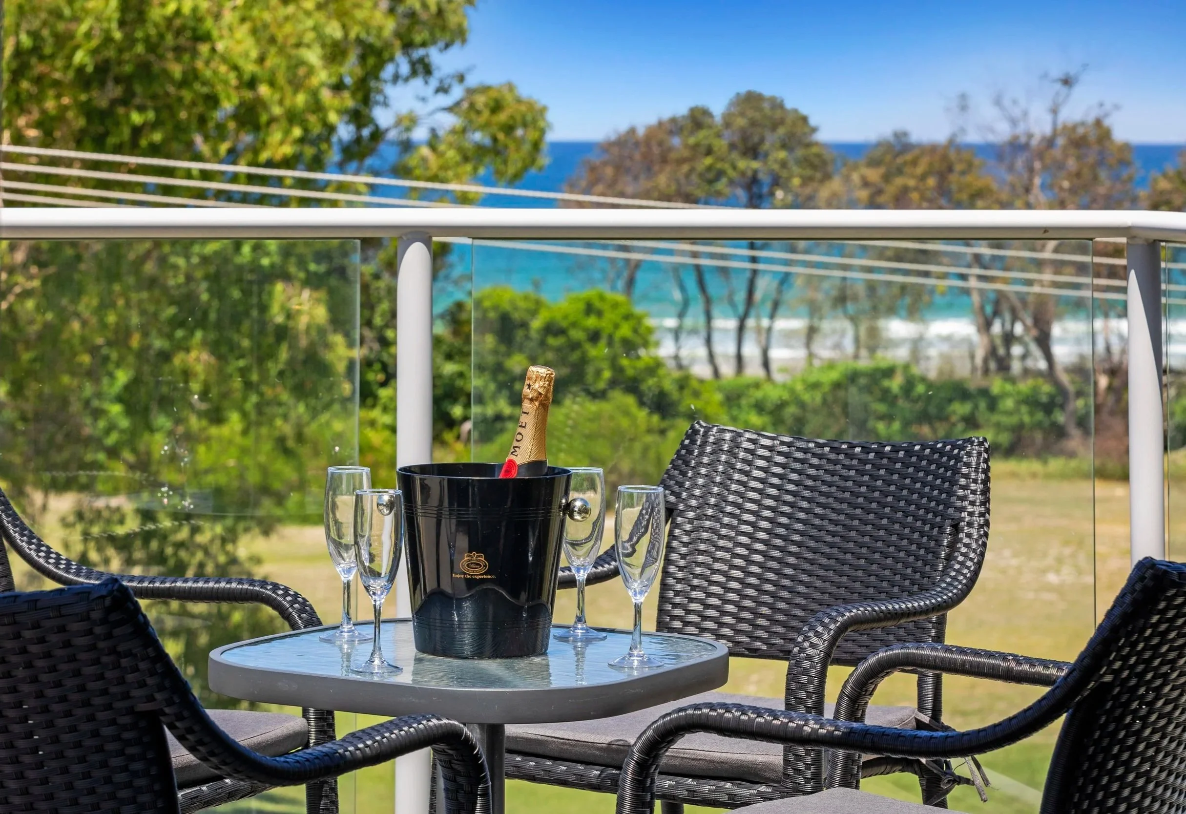 Outdoor table for sunset drinks on the private rooftop terrace at Ming 3 .
