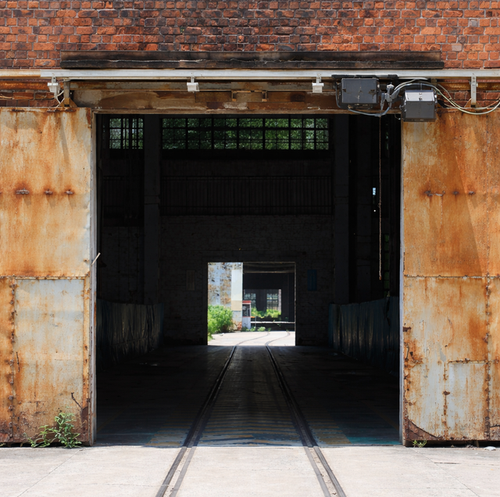 industrial trolley operator mounted above commercial steel door