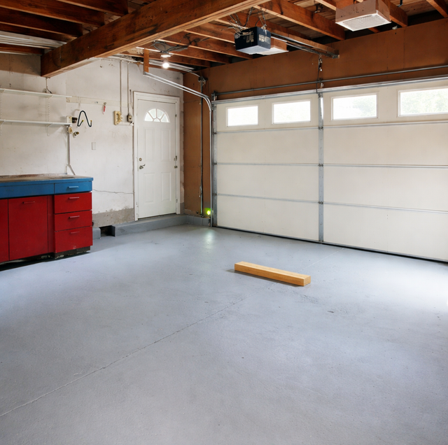 child reaching toward garage door opener button near step stool