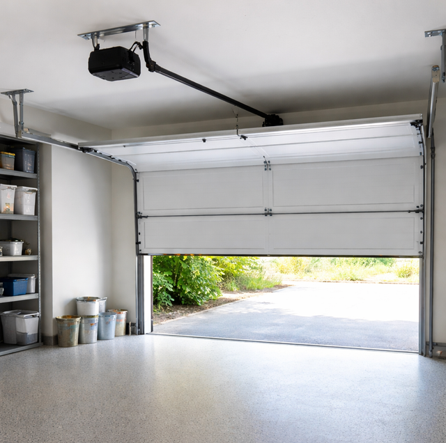 residential garage door sagging halfway with wooden prop beneath