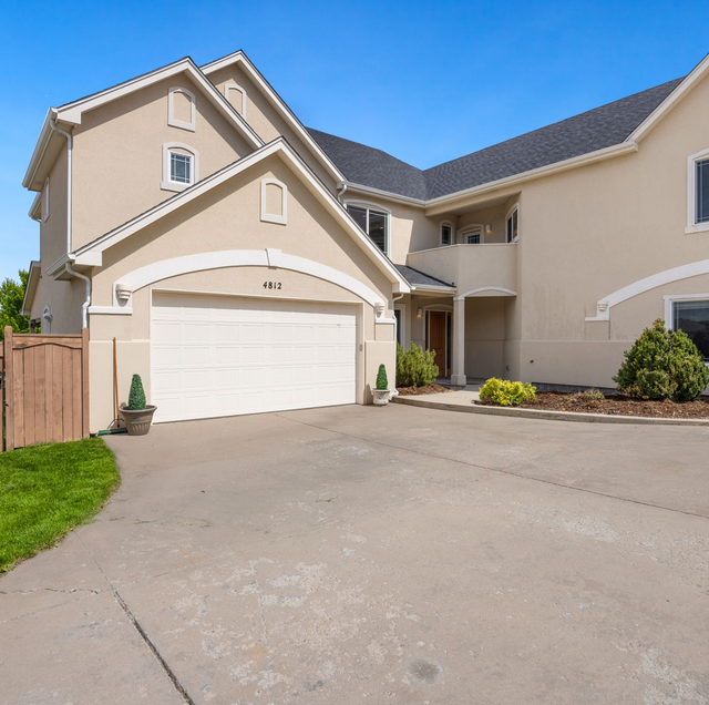 matching garage door styles on brick suburban house