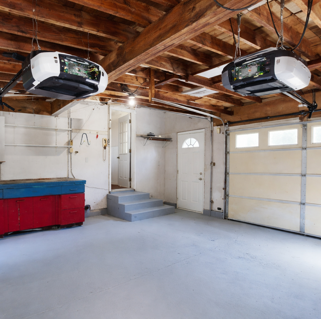 silver smart garage door opener mounted on white ceiling