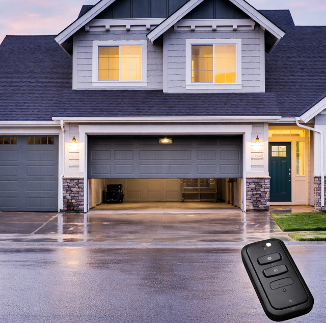 handheld garage door remote held out of car window