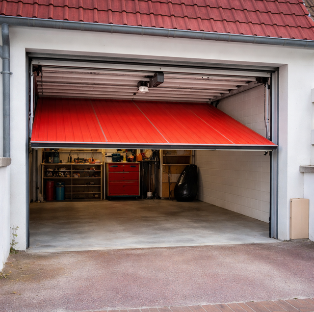 homeowner lifting garage door to test spring balance