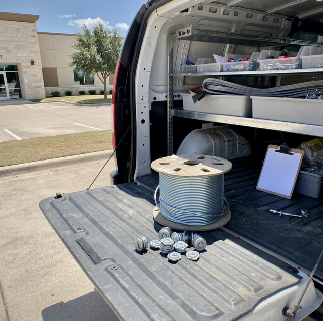 torsion springs and lift cables racked in service van