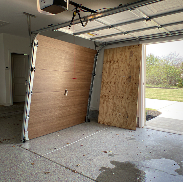 boarded garage door opening with plywood panels