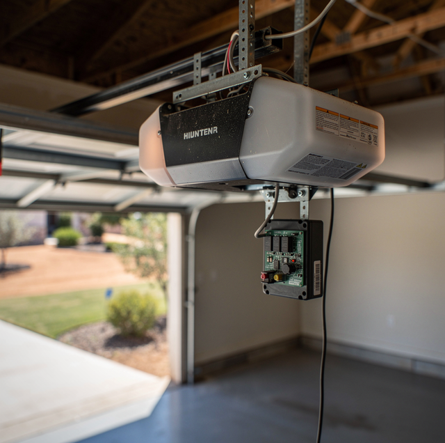 garage door opener with battery backup unit mounted overhead