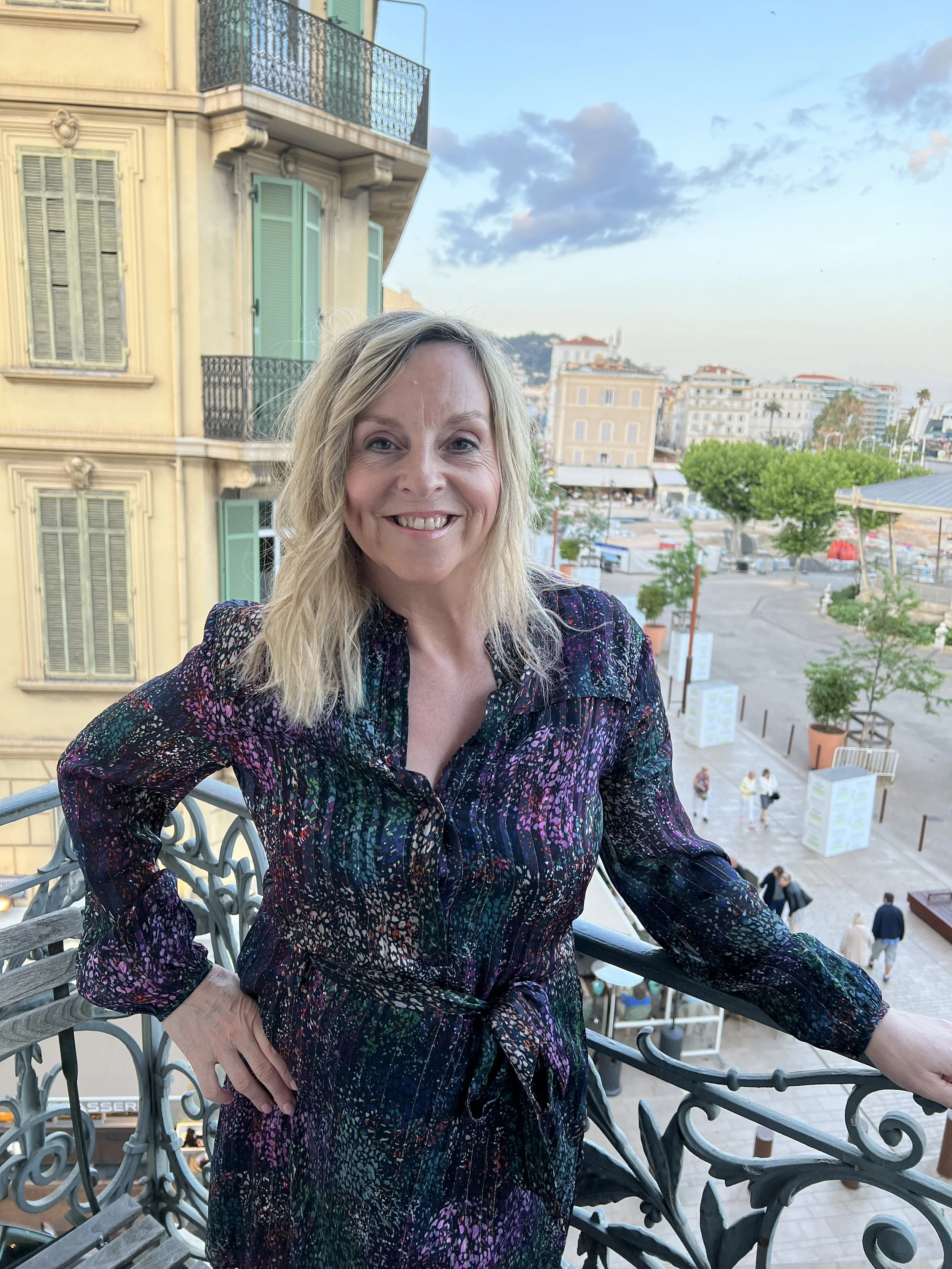 Susan McIntosh standing on a balcony in Cannes.