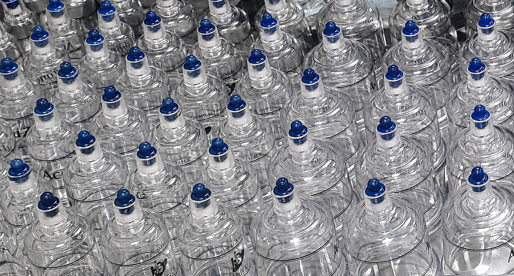 A large number of transparent plastic Chinese Medicine therapy cups arranged in rows.