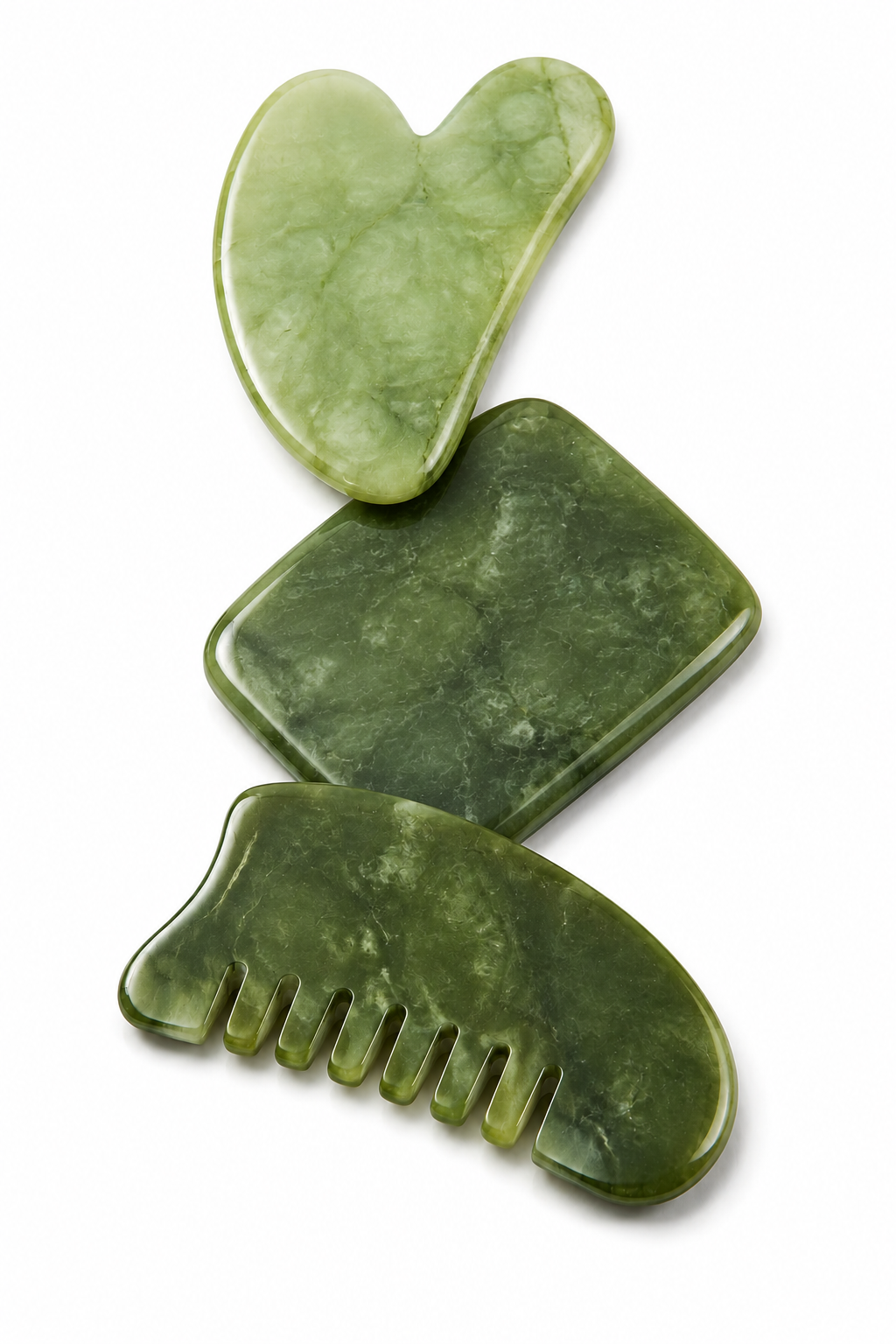 Three green jade grooming tools, including a brush, a scraper, and a comb, arranged vertically on a white background.