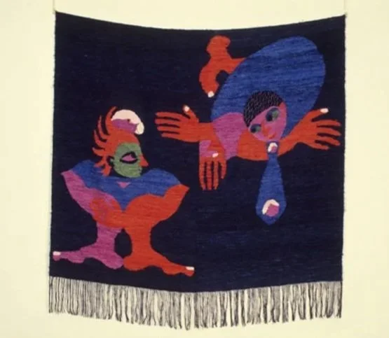 Colorful abstract tapestry depicting two figures with exaggerated features and vibrant colors against a dark background.