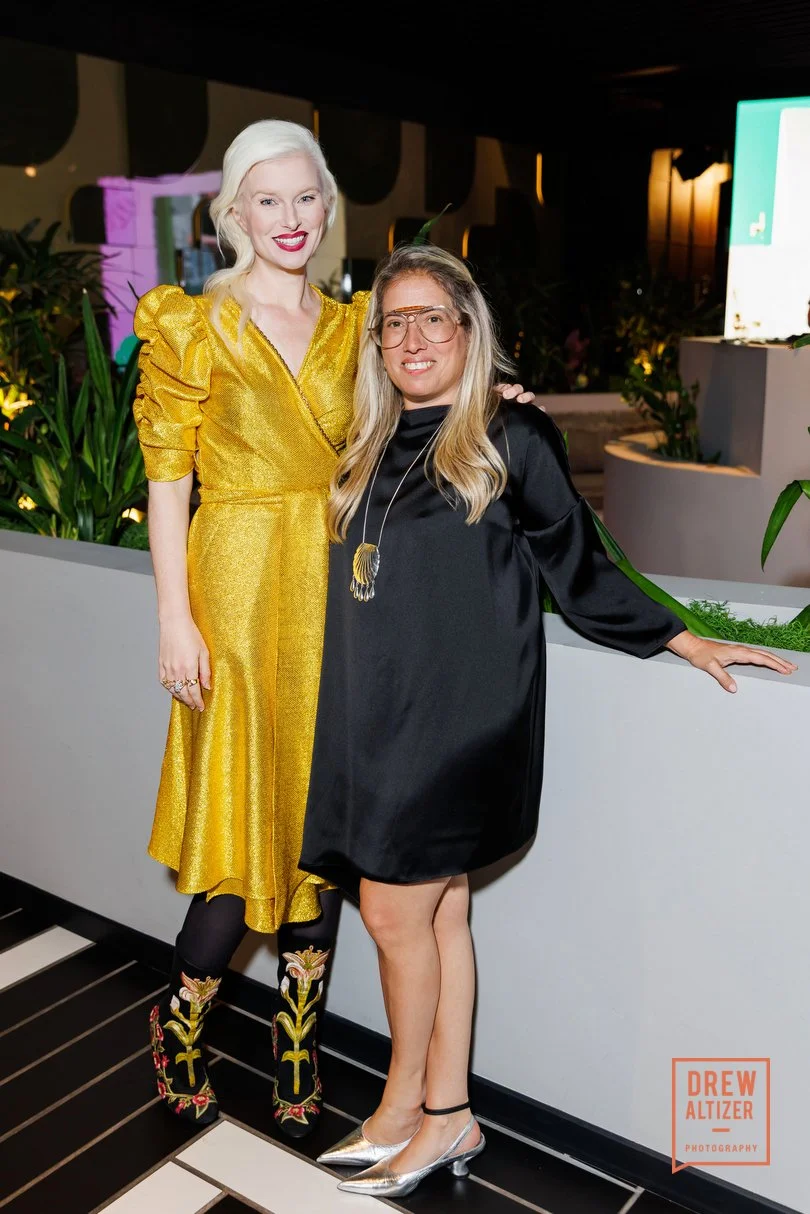 Natural light professional headshot of San Francisco creative director Kate Catalinac full body at event in gold dress.