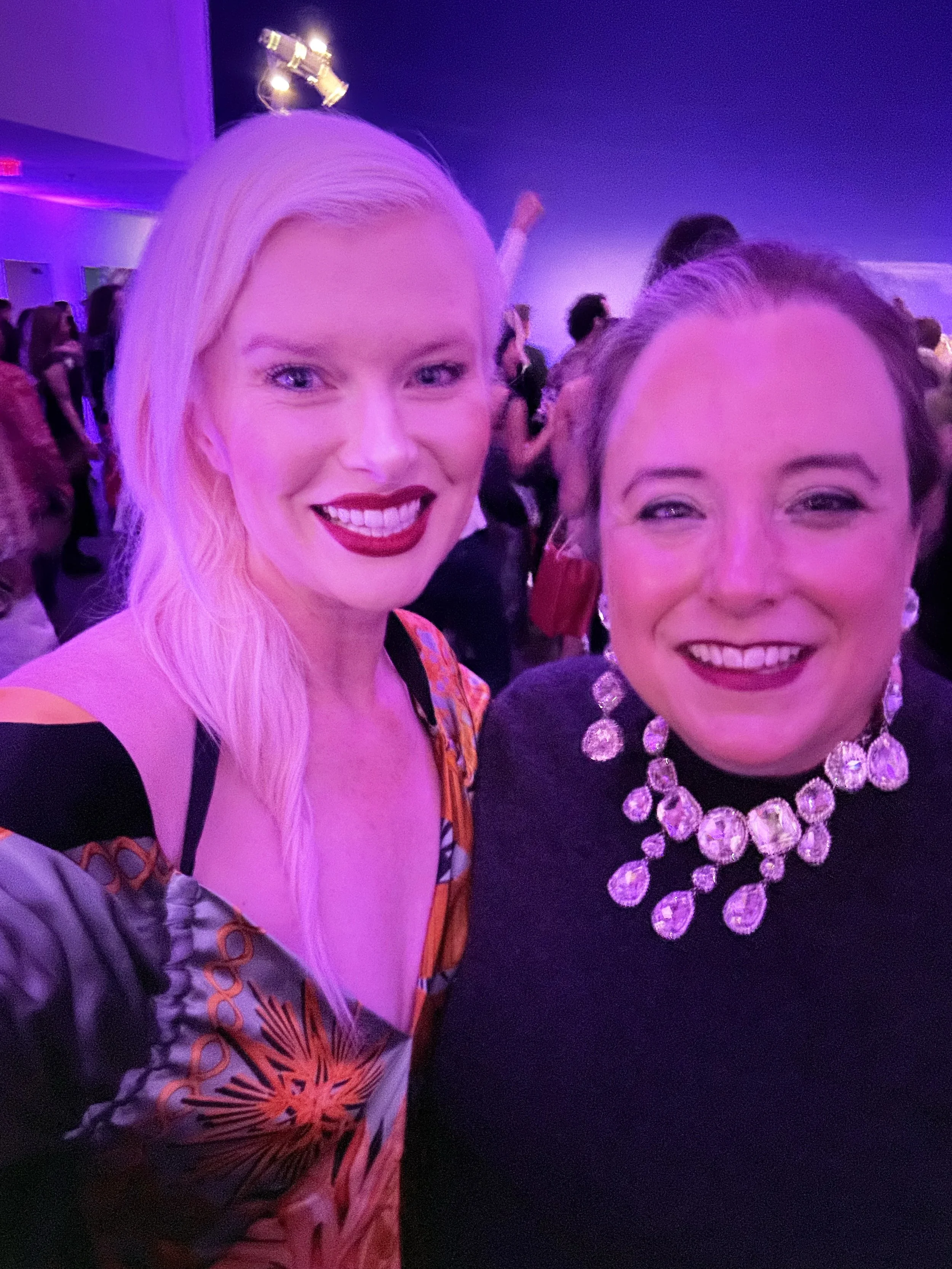 Bright, clean magenta tint professional headshot of San Francisco advertising executive Kate Catalinac and friend.