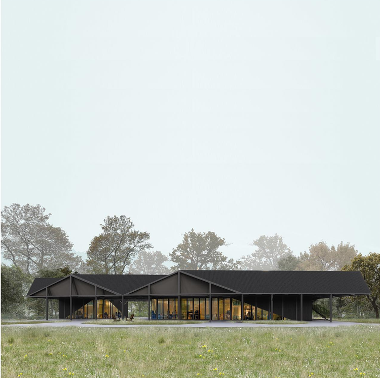 Un bâtiment moderne avec une toiture en pente, grandes fenêtres en verre, entouré d'arbres et d'une pelouse.