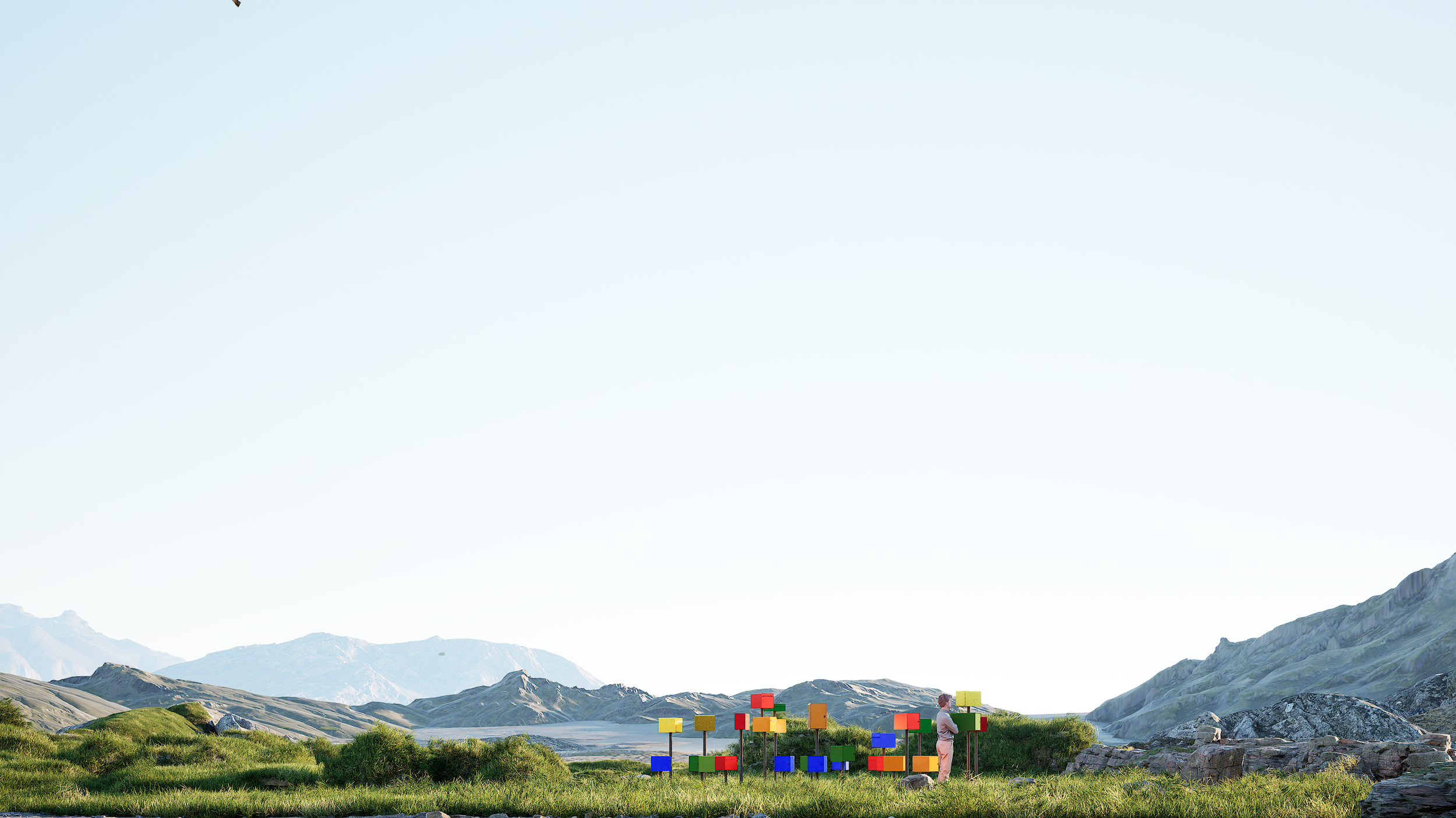 Paysage montagneux avec un ciel clair, des collines verdoyantes et des montagnes lointaines. En avant-plan, un homme se tient à côté d'une installation artistique composée de blocs colorés en bois.