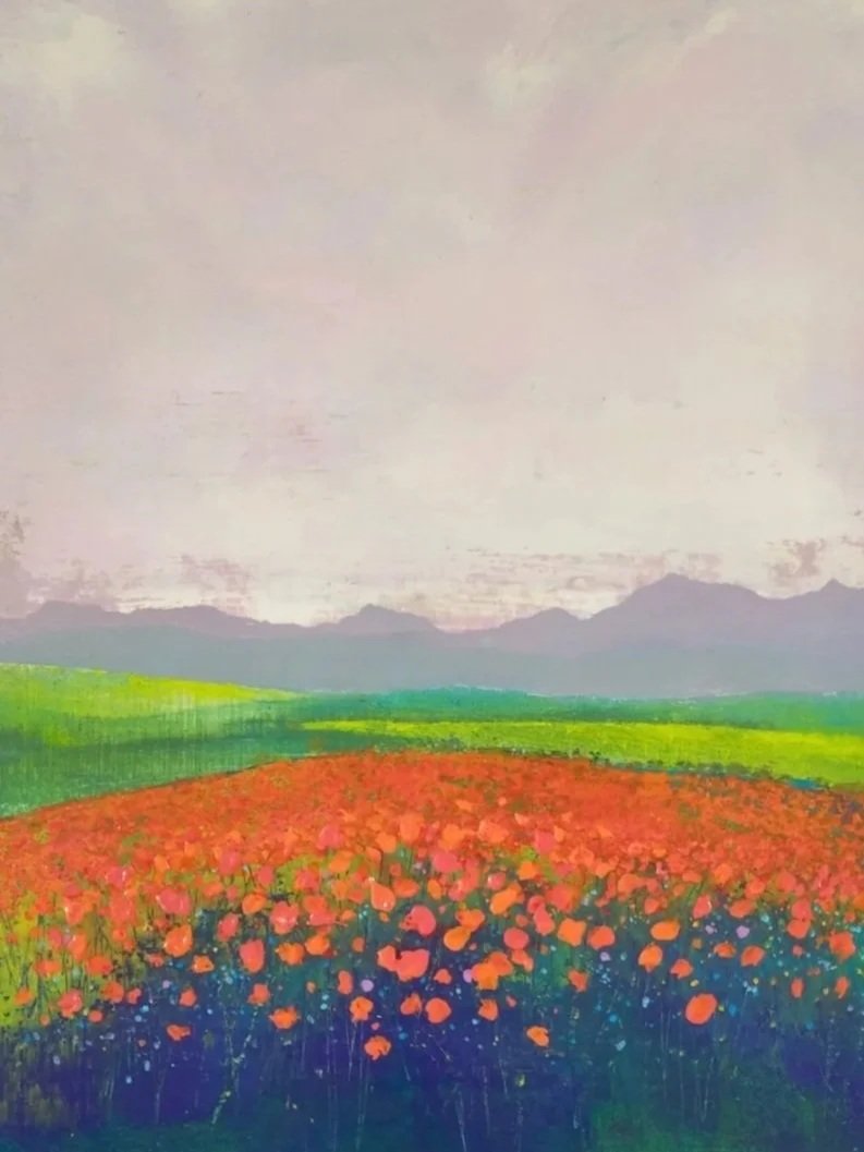 Painting of a colorful flower field with mountains and cloudy sky in the background.