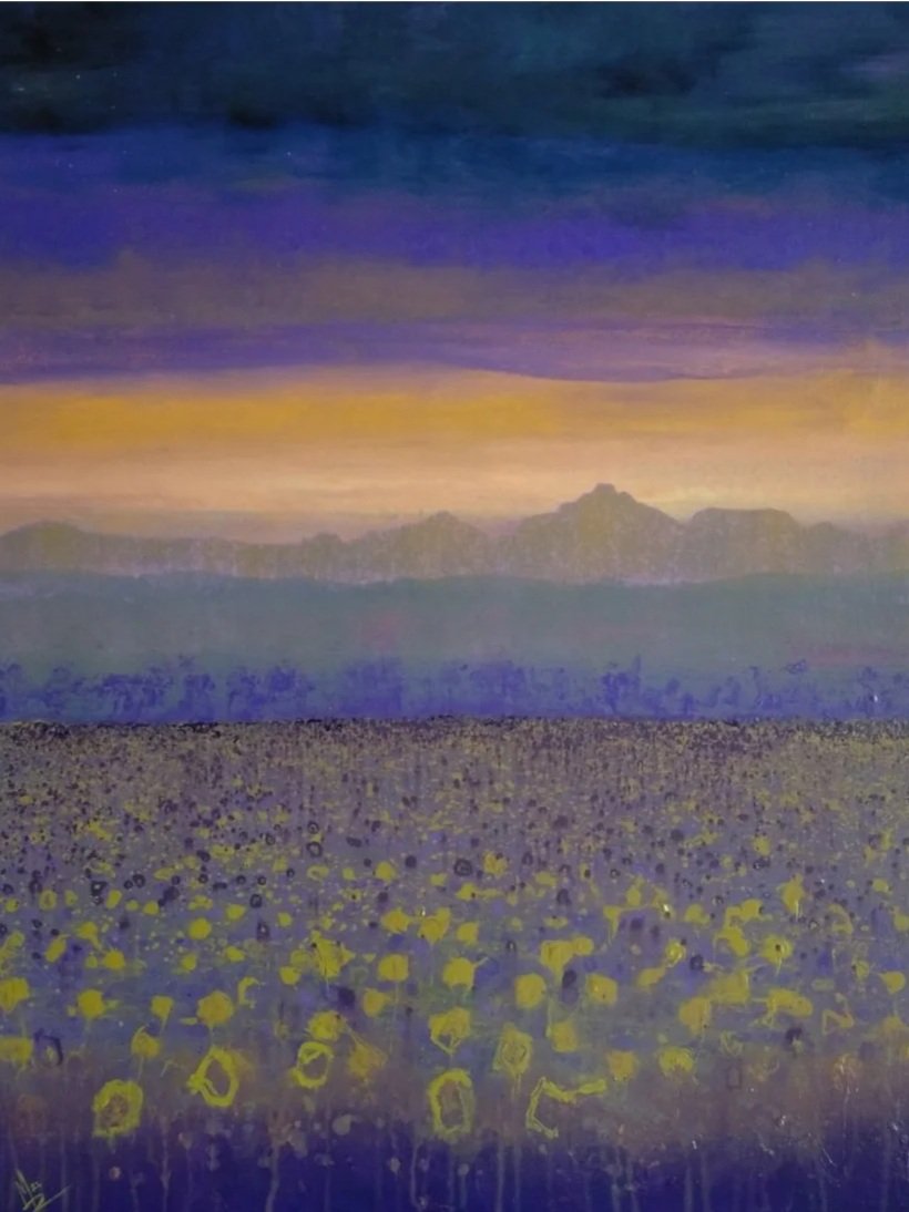 A landscape painting depicting a field of yellow flowers in the foreground with mountains and a colorful sky at sunset or dawn, featuring purple, orange, and dark blue hues.