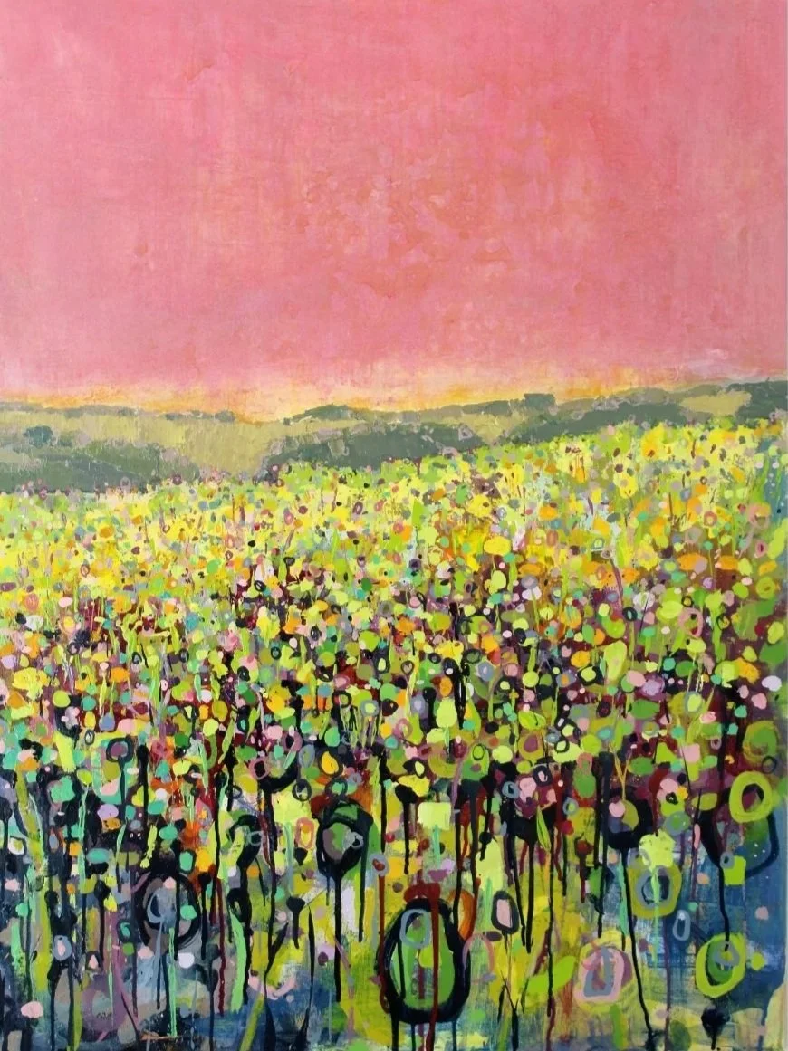 Abstract painting of a colorful field with a pink sky in the background.