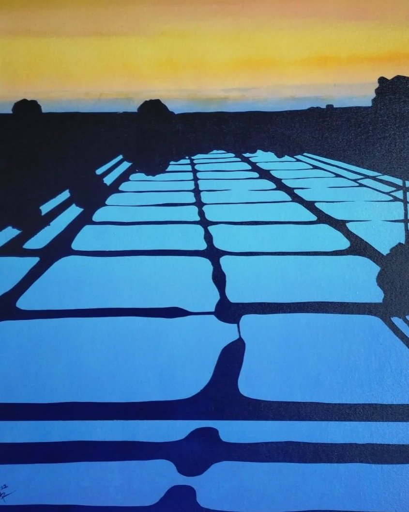 Silhouette of a bridge's shadow cast on a surface during sunset, with a colorful sky in the background.