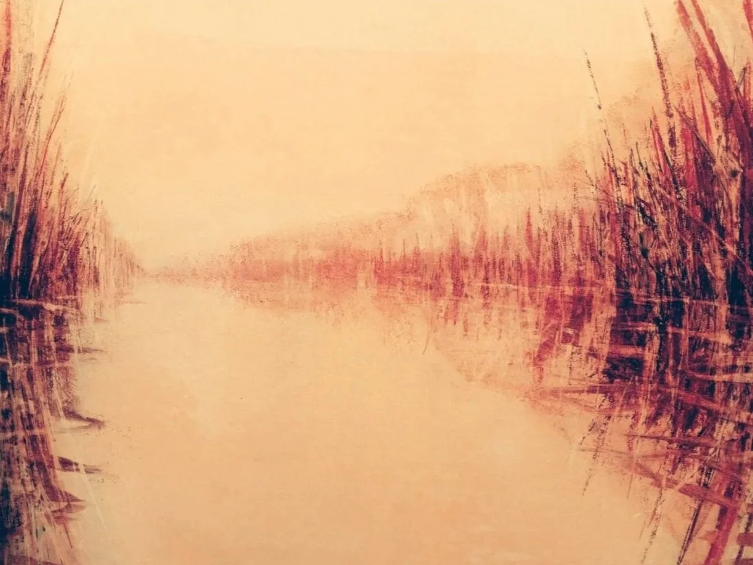 A boat docked on a calm river at sunset, with tall grasses on both sides and a warm orange sky.