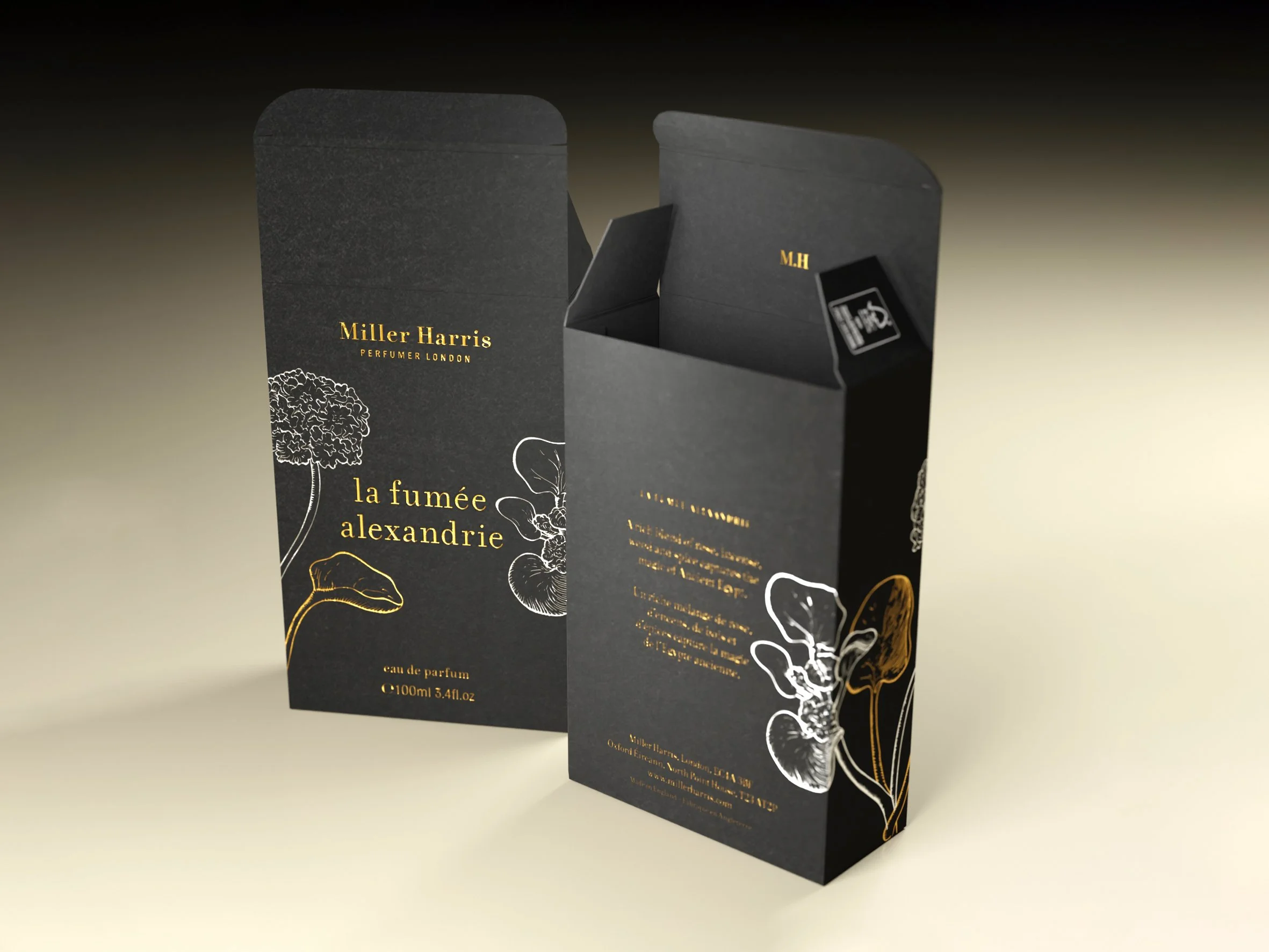 Black perfume box with gold lettering and floral illustrations, opening to reveal a perfume vial inside.