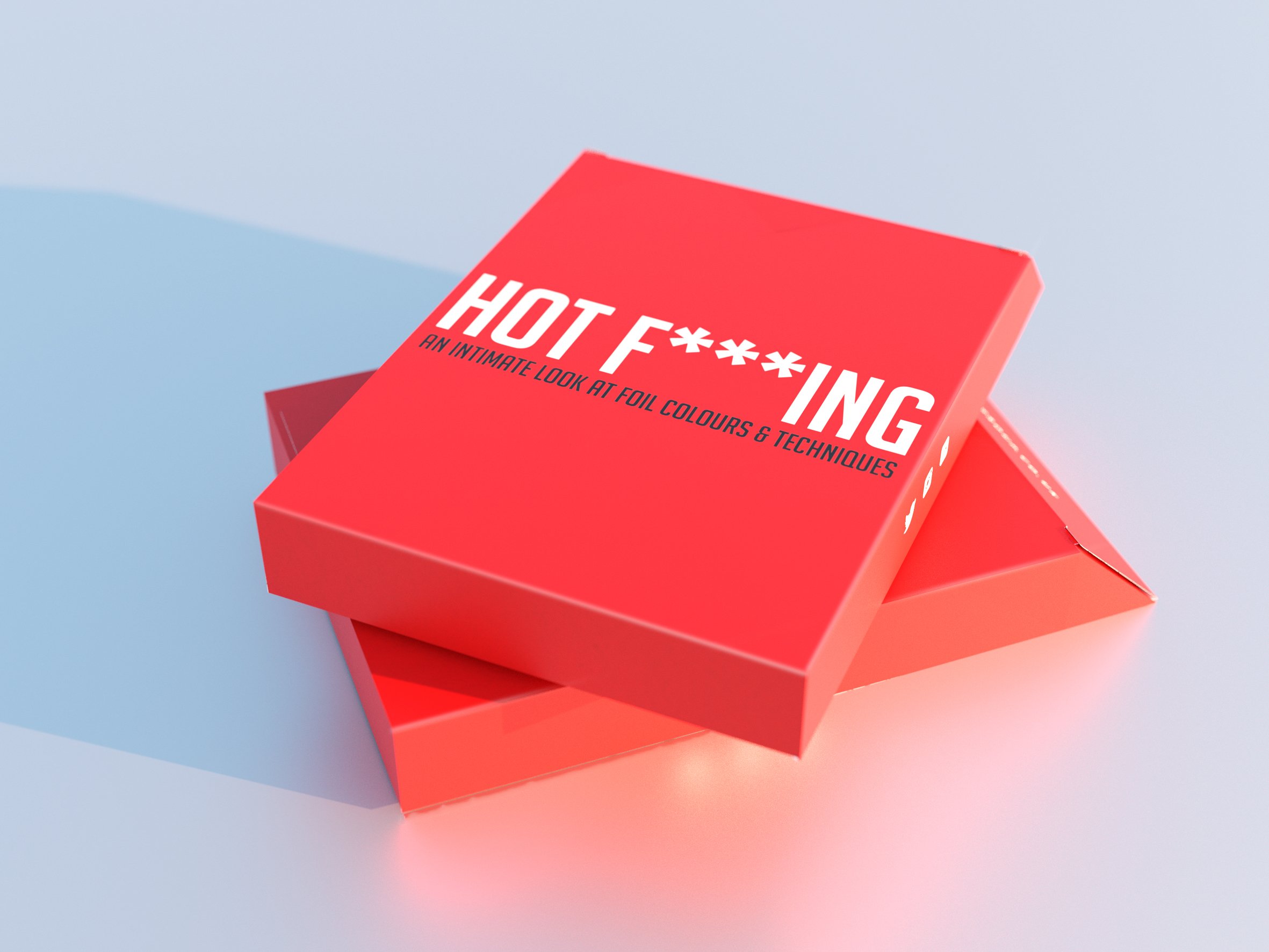 Red booklet with white text reading "HOT F***IN'" and black text underneath that says "An intimate look at foil colors & techniques," placed on a light blue background.