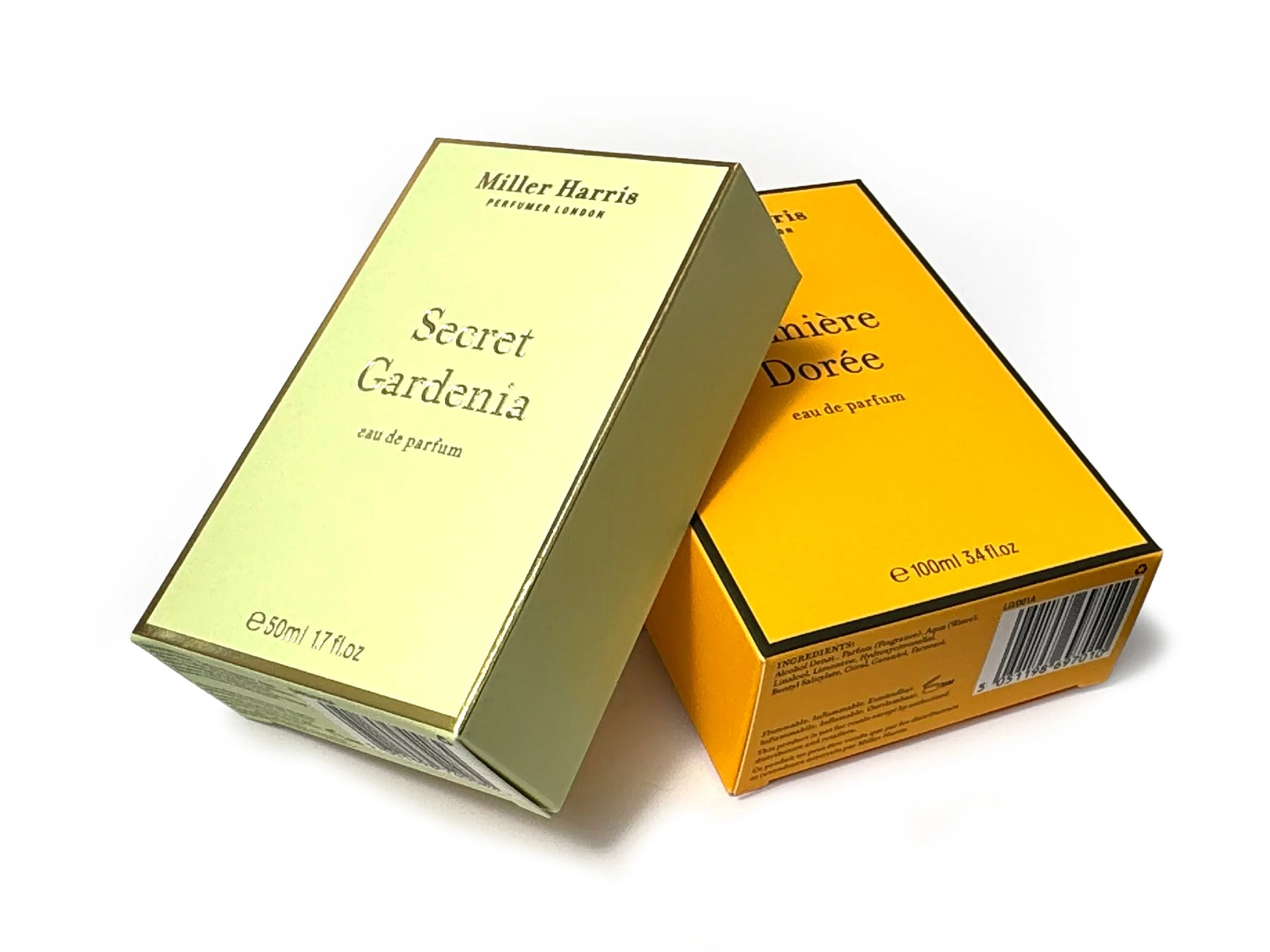 Two perfume boxes, one yellow and one orange, placed at an angle against a white background. Miller Harris carton produced by Windles Packaging.