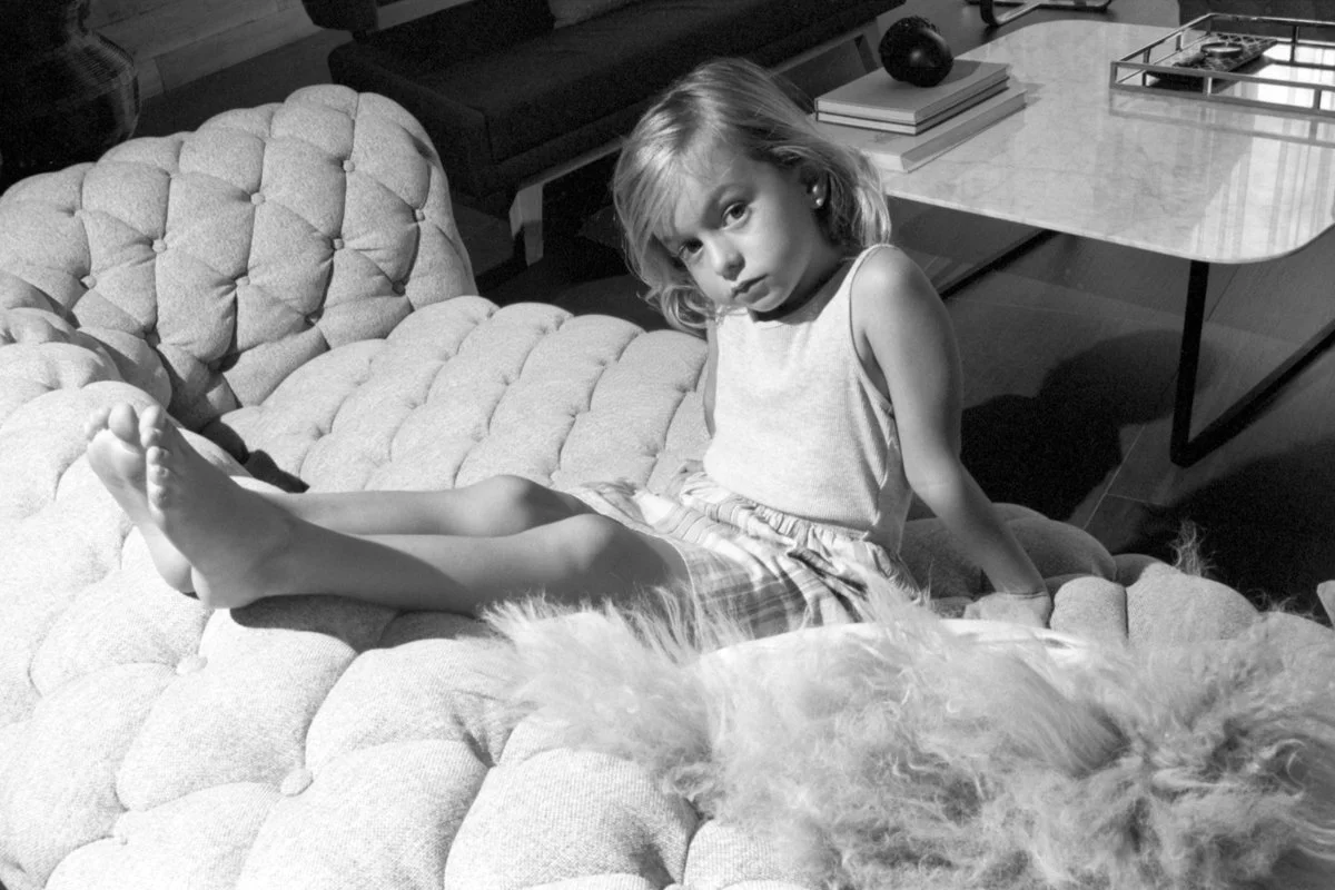 Portrait of a child sitting on a couch