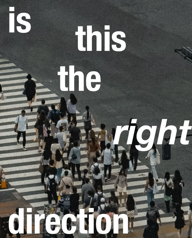 A busy crosswalk with pedestrians crossing in various directions at an intersection.