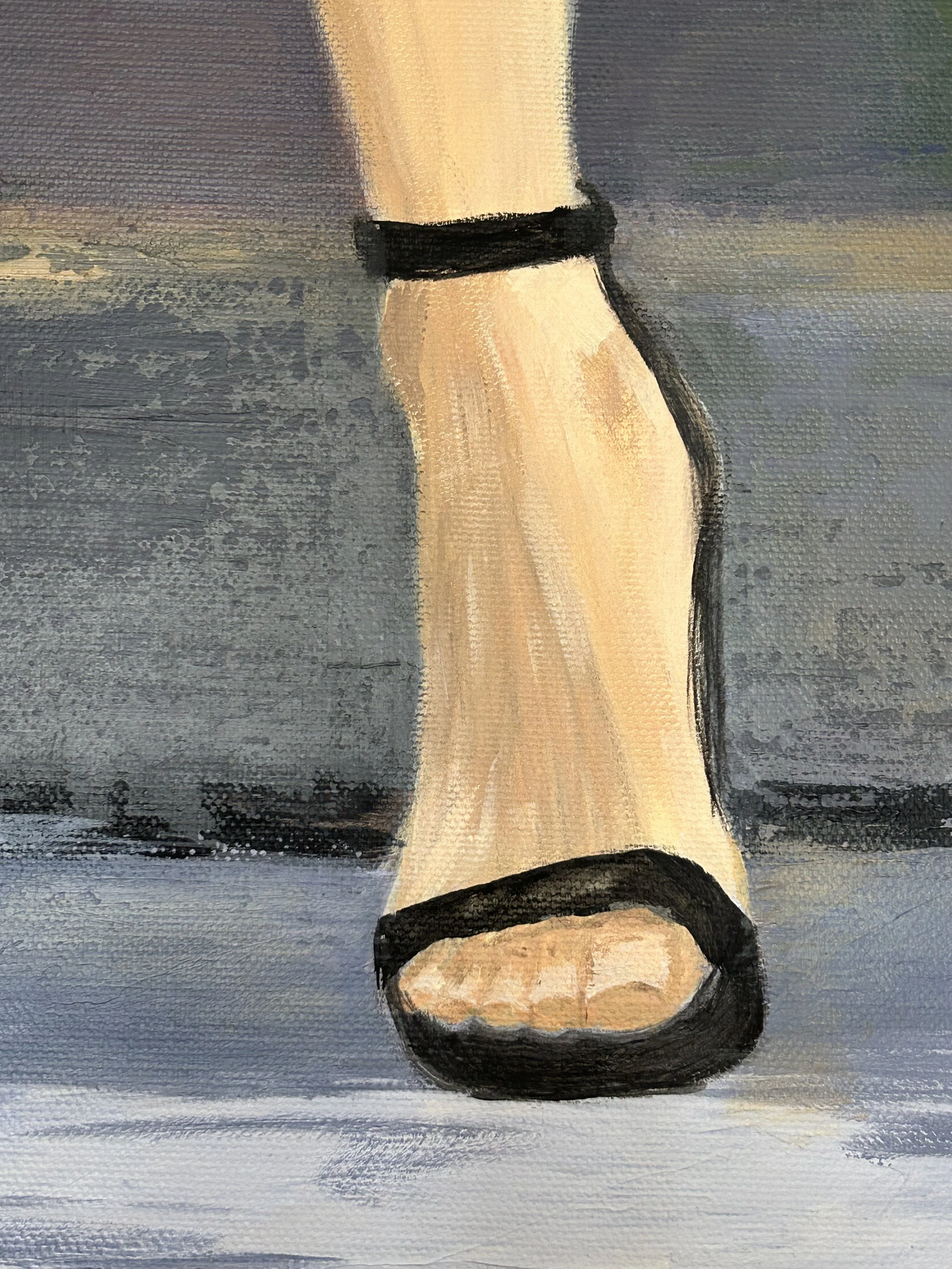 Close-up detail of Held Bloom by Inesa Levnell, showing a female foot and ankle in a black high-heeled sandal against a muted blue-grey background.
