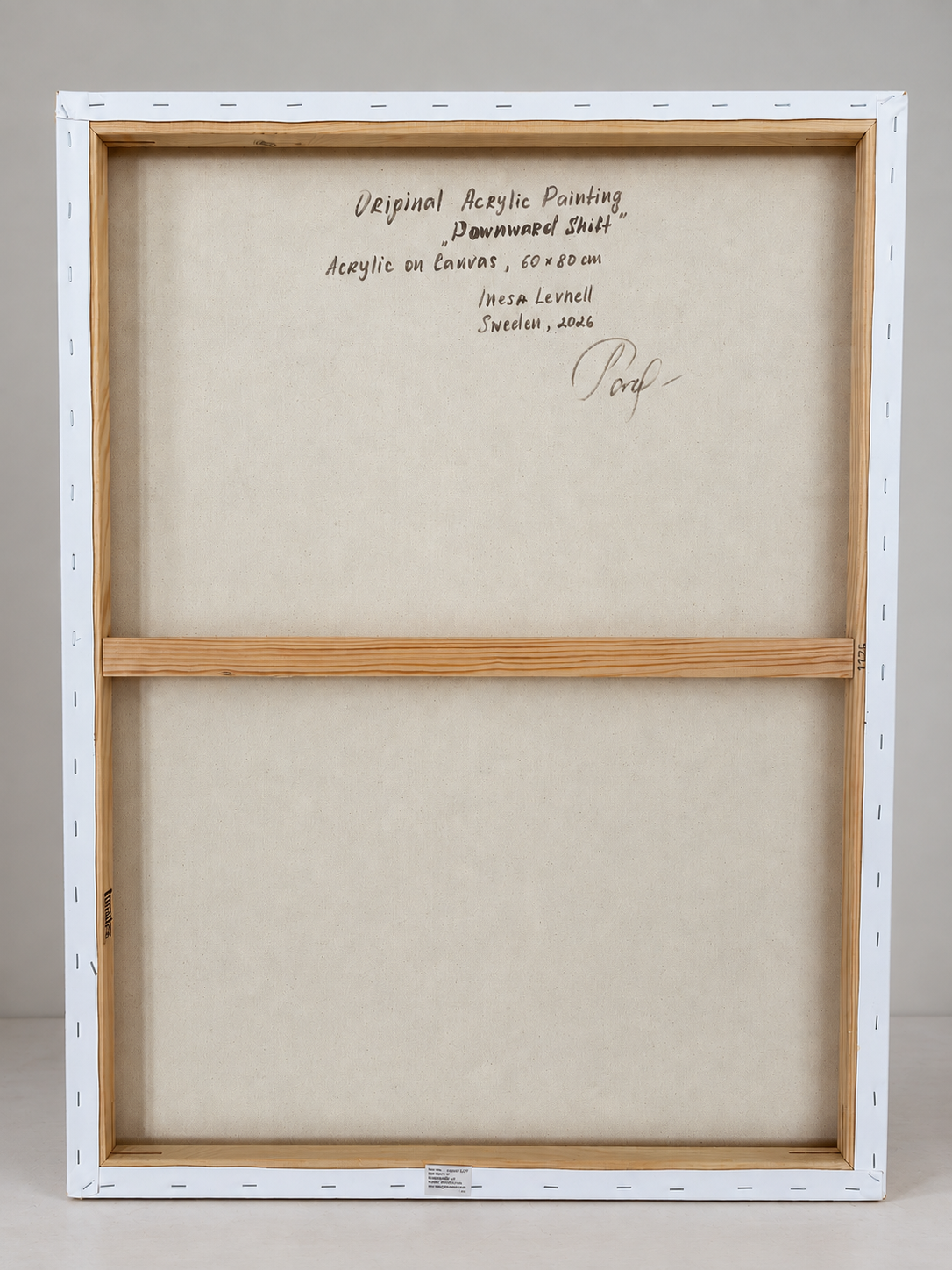 Back view of Downward Shift, showing the original stretched canvas, wooden stretcher bars and handwritten artwork details.