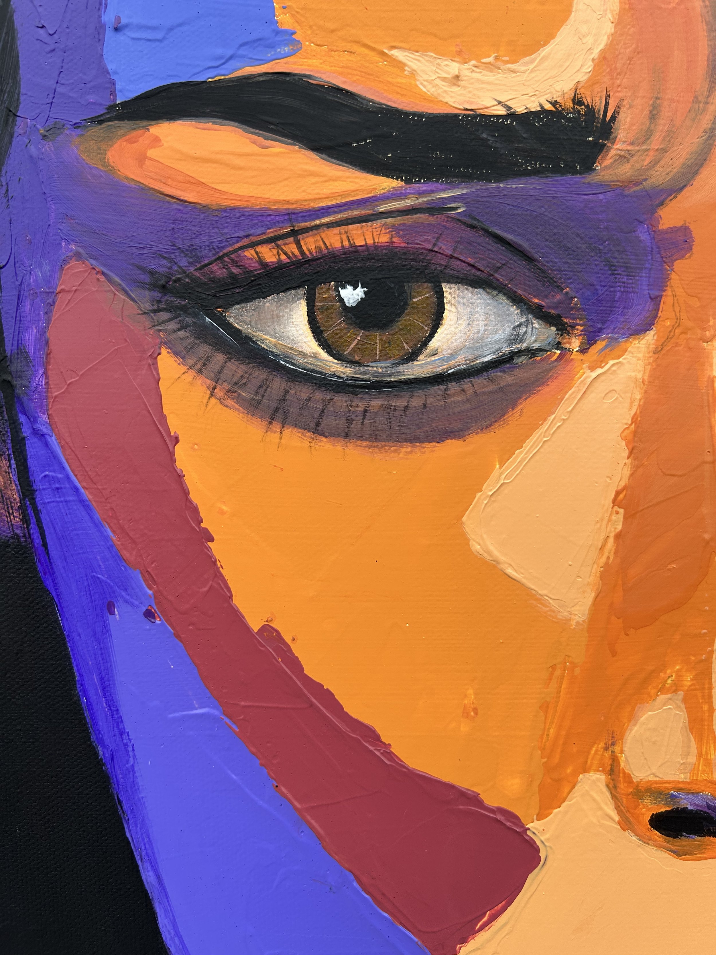 Close-up of Orange Static showing one eye, a strong eyebrow and facial colour planes in orange, violet, pink, beige and black.