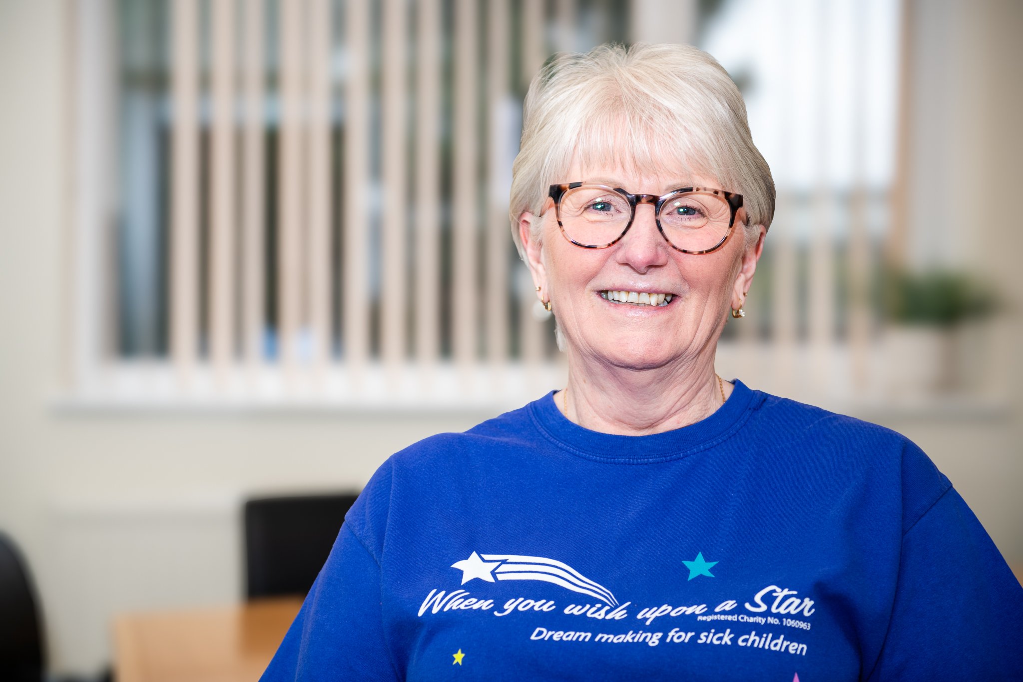 Professional Headshot of a woman with glasses on