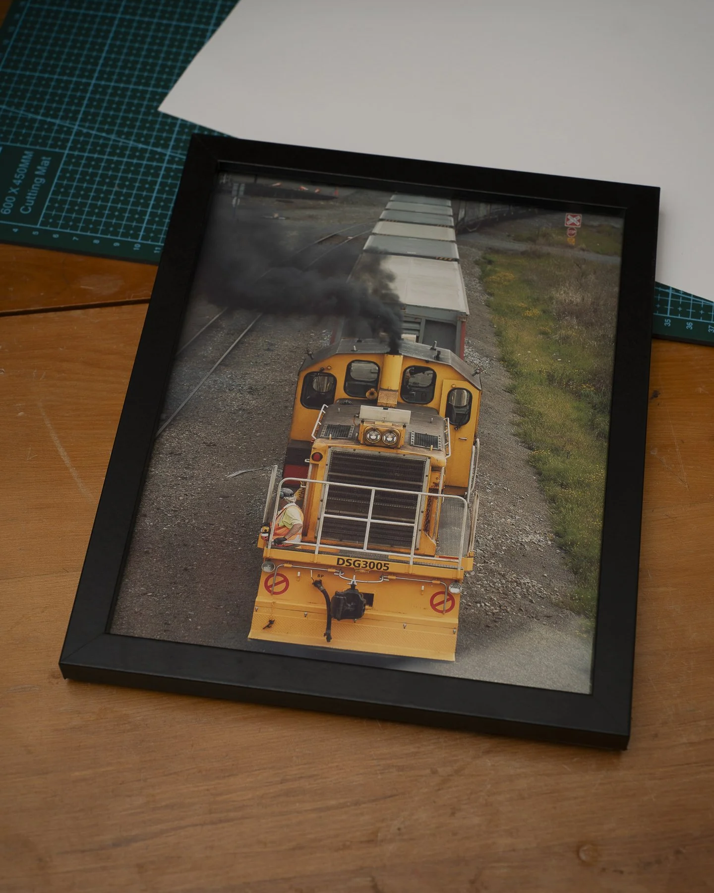 Photographic framed print of a Worker operating a train in Palmerston North
