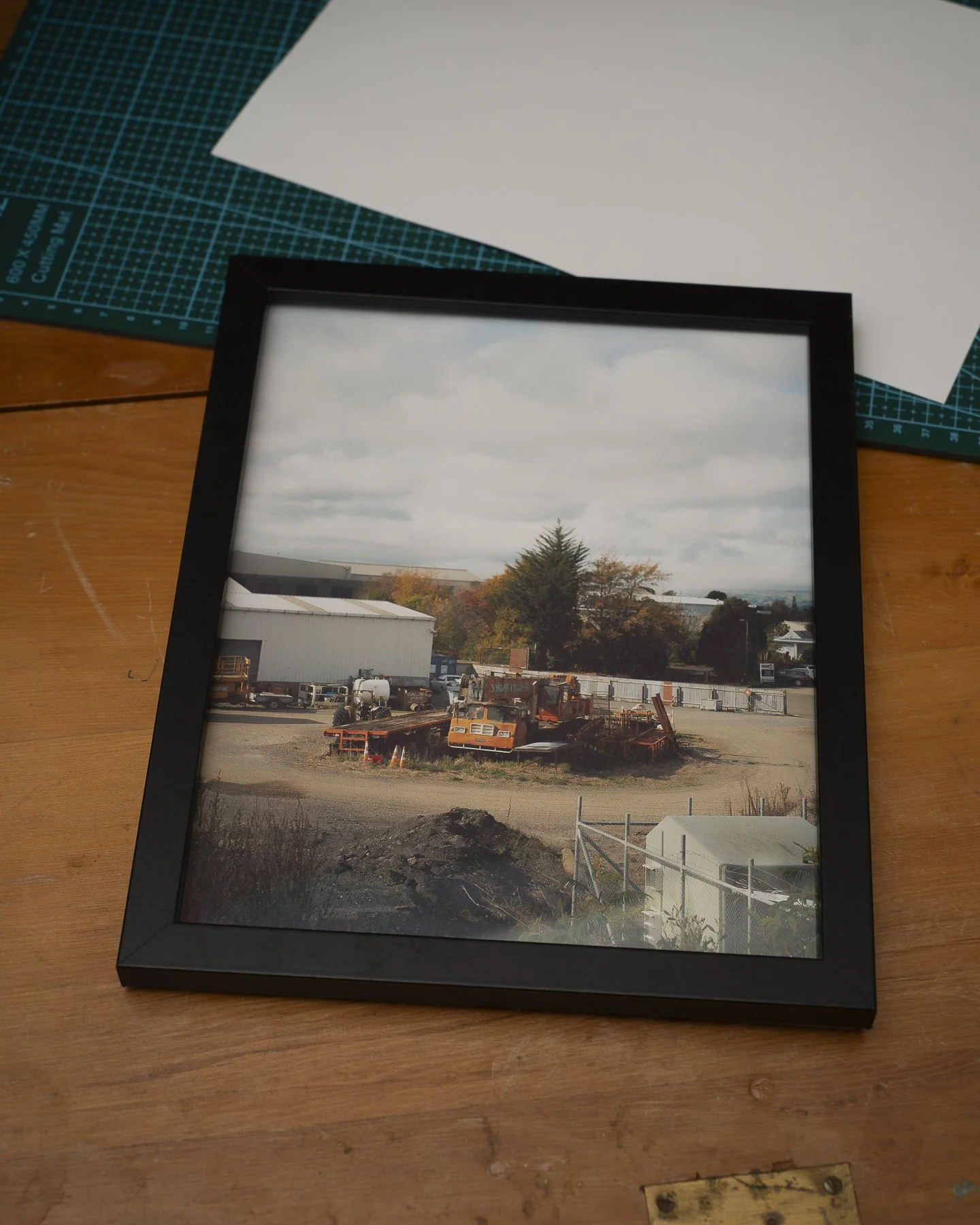 Photographic framed print of an old crane rusting in a yard in Palmerston North
