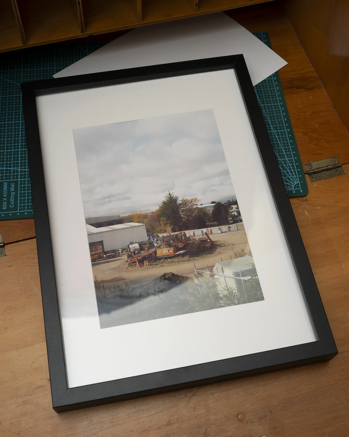 Photographic framed print of an old crane rusting in a yard in Palmerston North