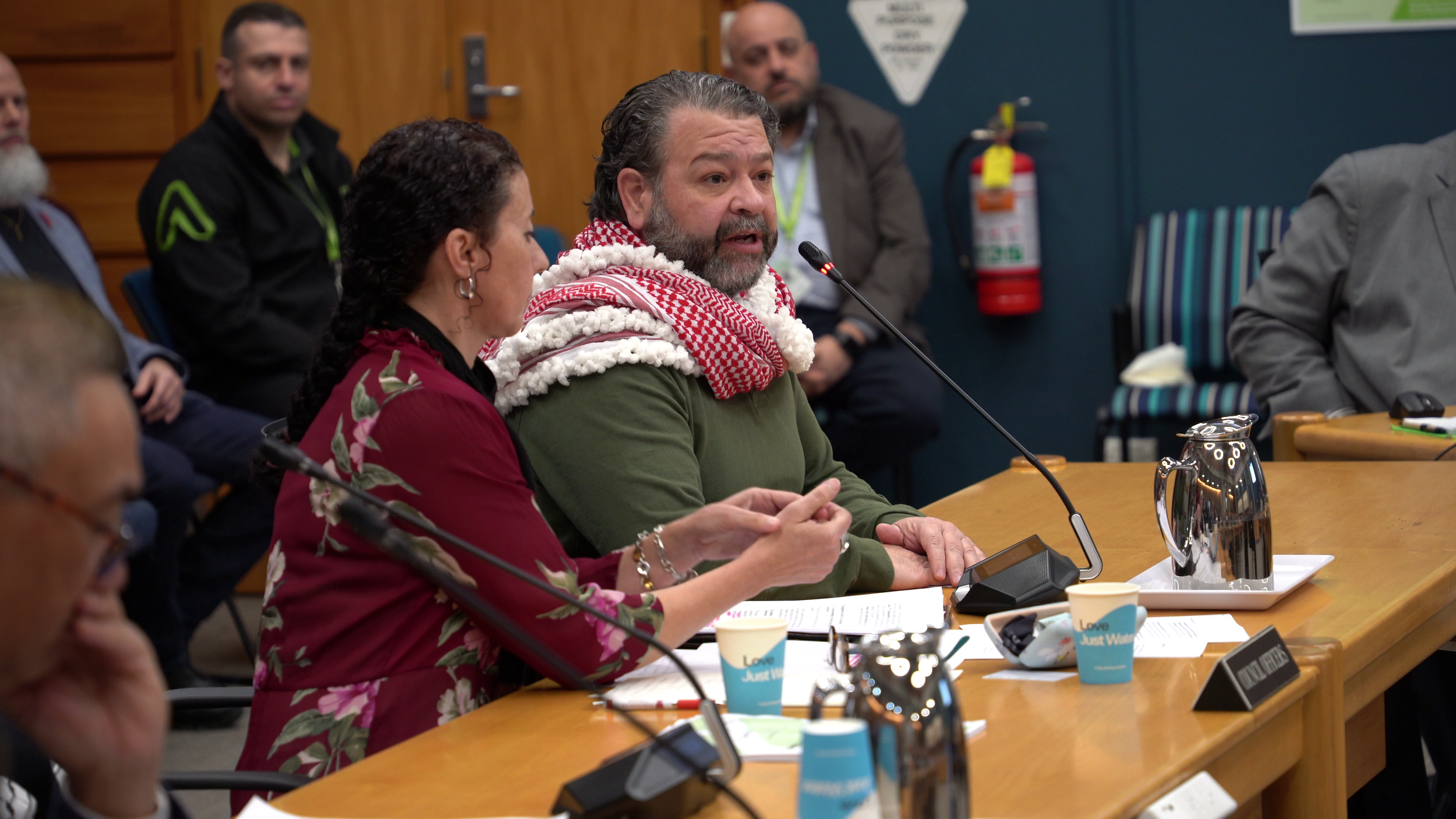 An example of Documentary Photography of two speakers submitting a petition to the Palmerston North City Council